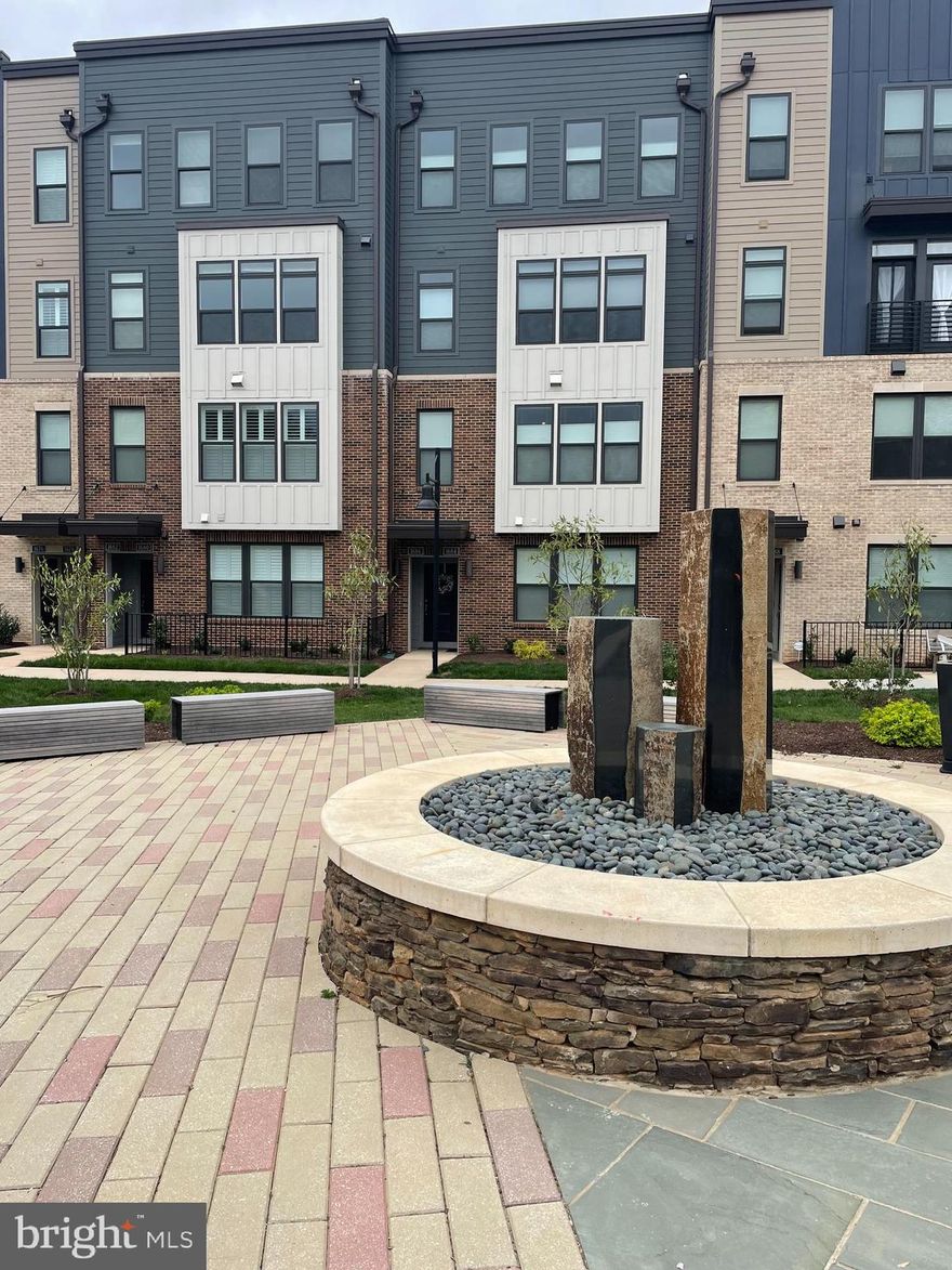 This 2 year new Stanley Martin built prime luxury townhouse style condo in the heart of Reston with low condo dues will not disappoint.  The modern floorplan filled with natural light has a great flow.   The gourmet kitchen is a chef's dream with large island integrates the dining and living spaces perfectly.  The upper level has 2 large bedrooms plus an upper level family room/den/office with deck.  The kitchen walks out to a one car garage (including EV outlet) and driveway parking behind.  The community also has ample on sight guest/owner parking right down the walkway from this unit.  The Tall Oaks community shares all Reston amenities including pools, parks, walking trails, playgrounds, tennis courts and lakes.  Plus the Tall Oaks community borders Lake Fairfax Park and is close to Lake Anne Saturday Farmers Market.  It is only a mile from Wiehle Silver Line Metro and W&OD Trail.  Plus you are only minutes from Reston Town Center, major commuting routes, shopping and restaurants.  Enjoy urban and suburban living at its finest!