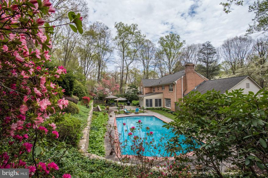 Owner Improvements and Upgrades   Kitchen Complete Designer Remodel; Lower Level Living Area Flooring, Interior Painting; Exterior Painting; Bathrooms Remodeled; Owner Suite Expansion and Remodel; Installation of 40-year Architectural Shingle Rood and Gutters; New Pool Heater; Installation of Rear Fencing; Hot Tub; Gazebo; Culligan Whole House Water Softener and Conditioner; Front and Rear Flood Lights, Patio and Corner Illumination; Main Level and Patio Stereo Speakers/House Wired for Sound System; Two Wells with Two Well Water Pressure Tanks; 400-amp Service Panel/Cat5 Wiring Whole House Surge Protection.Stunningly beautiful custom home on a lush landscaped 2-acre lot  with heated pool,  a quiet oasis on a prestigious street in the Potomac countryside. Acclaimed local builders Crowell and Baker built the 7000 sq ft brick home with an open, light-filled interior, superior craftsmanship and appointments, 5 - 6 bedrooms and 4.5 baths on three fully finished levels.  The large, bright two-story entry foyer with marble floor showcases a beautiful curved front staircase. The beautiful Living Room with masonry fireplace, elegant paneled Library, and luxurious Dining Room with crystal chandelier, feature beautiful hardwood floors, eleven-inch moldings and chair railing.  A gorgeous designer renovated Kitchen with granite center isle, bar seating, prep sink, breakfast buffet and built-in desk, sits at the heart of the home. A lovely Family Room with large windows and stone fireplace opens to the Kitchen. The spacious Sun Room with heated ceramic floor has walls of windows and French doors to the garden. Nature lovers and entertainers will appreciate the outdoor living space with its beautifully landscaped grounds, large flagstone patio for al fresco dining, large heated gunite pool, large covered gazebo, new hot tub, and stone walled gardens. Front and back staircases lead to the upper level, with its large Owners' Bedroom, great closet space, luxurious renovated Owners' Bath and adjoining Sitting Room/Office with balcony. The fully finished lower level provides a large carpeted Recreation/second Family Room with fireplace, Game Room and bar, large room suitable for live-in served by a new Full Bath, and walkup stairs to the back yard. Hardwood floors, plaster moldings and chair rail and fresh carpeting. The oversized two-car garage opens to a mudroom on the main level of the home.  The beautiful natural surroundings, including stone walls and gardens at the front and rear of the home, and semi-circular driveway entrance, add to the allure of this lovely home in move-in condition. Welcome!