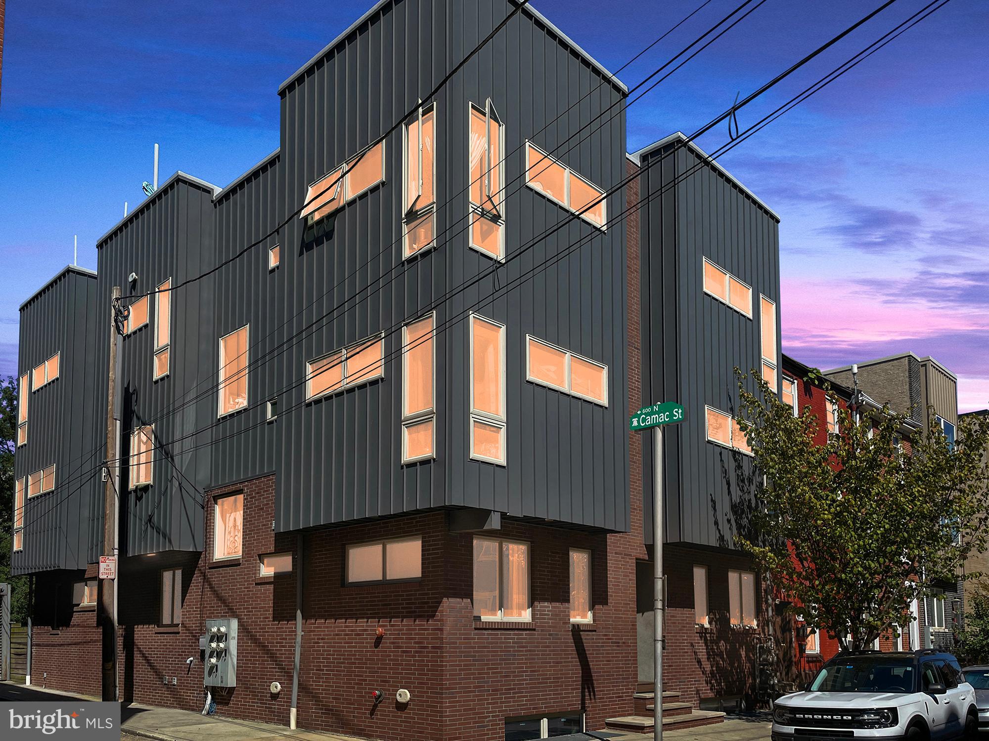 We are excited to introduce this exclusive condo, built on three levels, with parking, outdoor patio, close to The Rail Park and the Divine Lorraine. High end finishes with many windows allowng light to SCREAM IN!!!