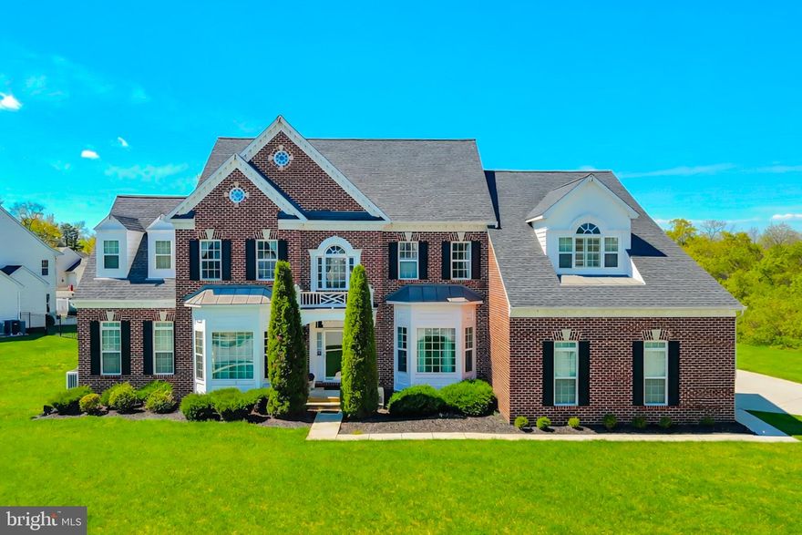 Welcome to this stunning luxury estate offering 5 bedrooms and 5 full bathrooms, thoughtfully designed for elegant living and exceptional entertaining. From the moment you enter, you are greeted by a grand foyer featuring Roman-inspired pillars, porcelain tile flooring, and extensive crown molding throughout.

This home boasts cathedral ceilings and a spacious, open layout filled with natural light. The gourmet kitchen is a chef’s dream, complete with quartz countertops, a large center island, and an eat-in area, perfect for everyday living and hosting guests. Adjacent is a formal dining room showcasing coffered ceilings, chair rail molding, and timeless architectural detail.

The expansive primary suite offers a private retreat with a sitting area, an extended walk-in closet with custom island, and a luxurious spa-like bathroom featuring a soaking tub with jets, double vanities, and a glass block shower.

A highly desirable main-level bedroom with a full bath provides ideal accommodations for multi-generational living or guests.

The fully finished lower level is an entertainer’s dream, featuring a custom bar with quartz countertops, built-in dishwasher, ice maker, and refrigerator, along with a theater room, fitness room, game room, and a large open entertainment area.

Additional highlights include a 3-car garage, oversized driveway, brand new roof, whole-home intercom and sound system, and an in-ground sprinkler system.

This exceptional property combines luxury, space, and functionality—perfect for modern living at its finest.