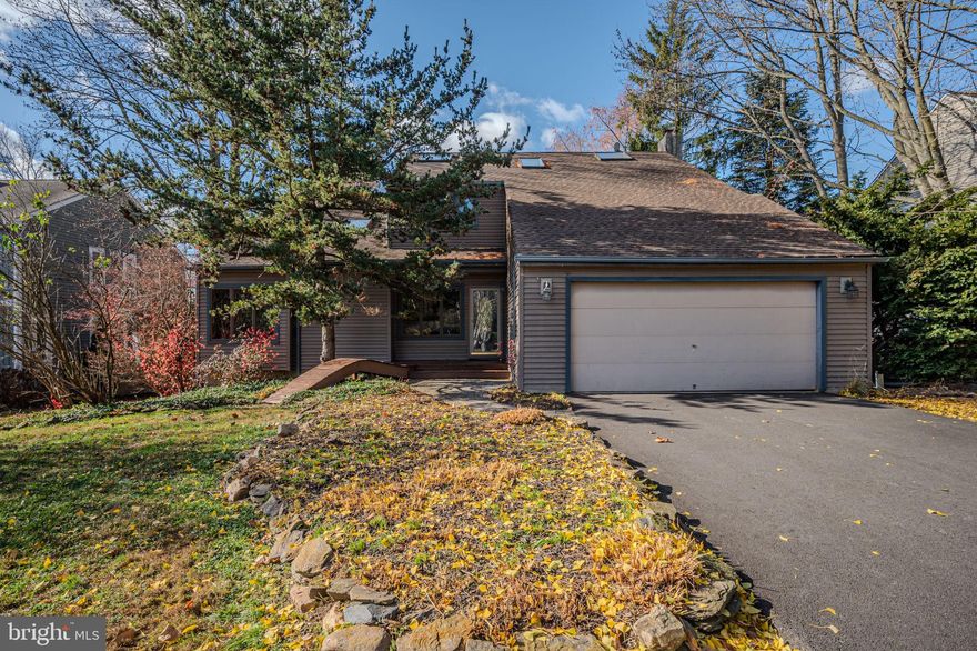 This contemporary home has it all…. blending soothing modern design with a breezy, open interior and a private & peaceful outdoor setting. All of this, within the wonderful community of Yorktowne.  Step inside to hardwood floors extending into the gorgeous wide-open living & dining space with vaulted ceiling, skylights, and airy views upstairs to the second level. Flow into the main living area featuring a loaded kitchen with 42-inch cabinets, granite countertops, stainless steel appliances, and a perfect coffee-bar area. The adjoining dining space flows into the sunken family room, highlighted by a cozy floor-to-ceiling stone wood-burning fireplace, two walls of windows, and sliding glass doors leading to the expansive deck.  Extending almost the entire width of this home, the multi-level deck is the ideal setting for grilling, dining, relaxing, and entertaining with a view of just trees and sky. Enhancing the outdoor beauty are the lavish flower beds which add seasonal beauty and stunning pops of color. Back inside, a half bath and the laundry complete the main level. Upstairs are all four bedrooms and two full baths, including a large primary suite with vaulted ceiling, walk-in closet, and a renovated bath featuring a glass shower, granite vanity, jetted tub, and skylight overhead. A spacious second hall bath, also with lovely natural light, serves the additional bedrooms. A full, unfinished basement provides extra storage or extra living space, should you choose to finish in the future. Bonus features include a 2-car garage with new driveway, Anderson windows, and an energy-efficient geothermal system for heating and cooling.  Situated on a half-acre within the Red Clay Consolidated School District and just minutes to Hockessin, downtown Newark, and Wilmington.  Be sure to schedule a showing today!