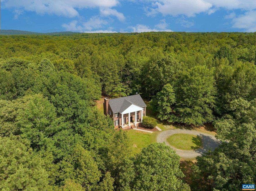This stately brick Colonial offers timeless appeal and a serene setting, tucked into 25+ acres of wooded privacy. The traditional floor plan includes a welcoming foyer, formal dining room, half bath, spacious living room, and a large eat-in kitchen with island, pantry, and laundry area. Step outside to the expansive Trex deck and enjoy peaceful views of the private backyard and forest beyond. Upstairs, the primary suite features a vaulted ceiling, walk-in closet, and en-suite bath. Two additional bedrooms, a full hall bath, and a versatile 4th possible bedroom/office/flex space complete the upper level. The walk-out terrace level is mostly finished, offering a third full bath, storage, and space to spread out. With classic architecture and total seclusion, this is the perfect retreat just minutes from restaurants, shopping, and wineries. A true sportsman and nature lover?s paradise! Explore and expand the trails on your own 25 acres (which incudes a stream)- or head to the amazing Preddy Creek Park, just 1/2 mile away! Shown by APPOINTMENT ONLY PLEASE!,Fireplace in Living Room