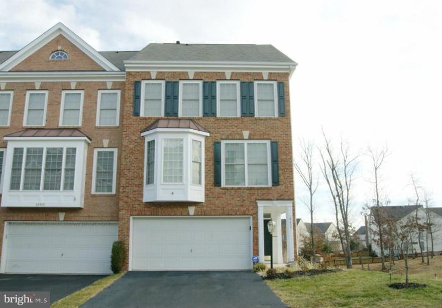 End Unit, Brick Front, Fenwicke Model, Over 2300 SF. 3BR/3.5BA. Hardwood and Carpet Throughout. Huge Deck Overlooking Professionally Landscaped Terraced Backyard and Fully Fenced, Opens to Private Wooded Common Area. Finished Walkout Basement, Potential for a 4th BR. Conveniently Located to Leesburg Outlets, Wegmans, Airport, and Rt 7.