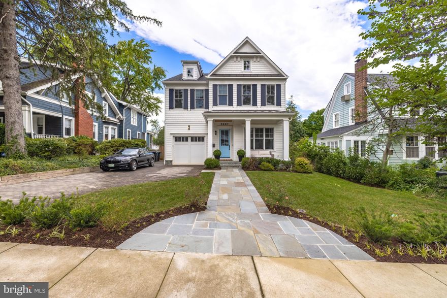 Welcome to 3607 Spring Street! Offering the perfect mix of modern luxury and spacious living, this stunning, contemporary residence is a recently constructed Colonial ideally sited in Chevy Chase. Spanning over 5,000 square feet, this six Bedroom, five and a half Bath home gleams from top to bottom with exquisite finishes, sleek millwork, and soaring ceilings across the open floor plan. The sun-drenched first level consists of light hardwood floors spanning throughout the Foyer, Front Hall, and Living Room, flowing through to the modern Dining Room, expansive Family Room, and Gourmet Eat-In Kitchen. The Family Room features beautiful exposed wood beams, a centerpiece gas fireplace, and direct access to the exterior Deck and stone Patio. The Kitchen, generously sized and a chef’s dream, boasts exquisite countertops, stainless steel appliances, and a double wall oven. The Pantry and additional storage spaces are adjacent to the Kitchen, including a Mud Room-style entryway with built-ins and tile floors that leads to the Attached Garage. A central staircase brings you to both upper and lower levels of this home.
The second level of this home features the spacious, airy Primary Bedroom suite, boasting beautiful hardwood floors, a luxurious en-suite Full Bath with two gleaming vanities, free-standing soaking tub, spa-like stall shower, and water closet, as well as two separate Walk-In Closets. Adjacent to the Primary Bedroom is Bedroom #2, which includes an en-suite Full Bath with tub shower as well as a Walk-In Closet. Bedroom #3 and Bedroom #4 are located just down the hall – both feature generous Walk-In Closets and are adjoined by a sleek Full Bath that includes two vanity sinks and a modern-tiled tub shower. The Laundry Room is also located on the second level, offering abundant built-in and closet storage space and a sink. Located on the upper level of the home is a bright, expansive Recreation Room that features vaulted ceilings and a loft-style overlook to the central staircase. Bedroom #6, a versatile space that can also be used as a Home Office, is located just next to the Recreation Room and offers both an en-suite Full Bath and a spacious Walk-In Closet. Offering even more space to entertain or simply relax, the lower level of this home includes a Gym, Billiard Room, and additional Recreation Room and wet bar. Several windows are sited throughout the lower level to bring in natural light for both the shared spaces as well as Bedroom #5, which adjoins a modern Full Bath with tub shower. The lower level also includes a Storage Room and a dedicated Mechanical Room. 
In addition to the space and versatility that this contemporary home offers, the exquisite exterior features are also unparalleled. The front of the residence showcases a well-kept greenspace with a beautiful stone front pathway that leads up to the Front Porch. In the lush rear yard, a fabulous Deck, Stone Patio, and Play Area provide great opportunity to entertain and enjoy the outdoors. In close proximity to shops, restaurants, recreation spaces, and both the Capital region and downtown Bethesda, this home is ideal for anyone looking to find modern, luxury living in Chevy Chase.