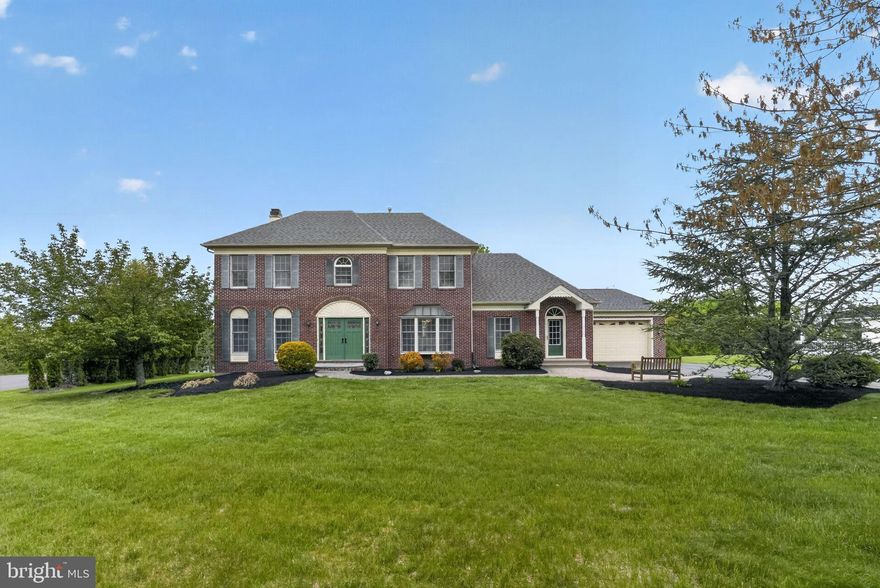 A true, one-of-a-kind gem located on a cul de sac in The Estates at Mainland Ridge, this one owner home offers something for everyone! Offering over 5800 square feet of finished living space on over an acre of land, this is a must see! Entering the two-story foyer with hardwood floors, a turned staircase, and a guest closet, one continues to the left to a private office featuring hardwood floors, crown molding, chair rail, and a ceiling fan with lights. To the right, the formal dining room showcases hardwood floors, triple crown molding, chair rail, and a bay window. The heart of the home is the expansive kitchen with hardwood floors, stainless steel appliances, a gas oven, recessed lighting, a large island with seating, butler’s pantry, and a built-in pantry closet. The bright eat-in area offers a triple window and direct access to the patio. Flowing from the kitchen is the inviting family room with a brick fireplace, plus a thoughtfully designed 10x6 homework/puzzle area with built-in desks and shelving, perfect for work, study, or hobbies. Just beyond, the stunning game room is a true showstopper with vaulted ceiling, hardwood floors, two skylights, ceiling fan with lights, triple window, and a wall of glass allowing for a magnificent view! Off the kitchen, the laundry room is well equipped with cabinetry, a sink, and a bank of closets, with access to both the backyard and the attached 2 car front entry garage. Accessible from this area is a large, versatile room currently used as a piano studio. This addition has a powder room, closet with built-in shelving and glass panel doors, track lighting, and a triple window, offering excellent potential for an in-law suite, an in-home office or private workspace. There is a very attractive separate entrance from the driveway to this area. Upstairs, the main bedroom suite provides a peaceful retreat with a huge walk-in closet and a private bath featuring a Jacuzzi tub, two sinks, and a stall steam shower. A connecting bedroom offers flexibility as a nursery, sitting room, or additional office. Two more generously sized bedrooms feature hardwood floors, double closets, ceiling fans with lights, and share a full hall bath. The fully finished walk out basement is full of possibilities.  Currently there is a kitchen area featuring a sink, mini fridge, and countertops, a combined living and dining space, separate bedroom area, and a full bath with stall shower. Additional spaces include a TV room, exercise room, hobby or music room, a large storage room, and multiple storage closets throughout. French doors provide direct access to the patio and pool area, seamlessly connecting indoor and outdoor living.  The rear of the property allows you to enjoy your own private retreat! With an expansive two-level paver patio, a very large in-ground pool surrounded by a wrought iron fence, an attached spa, and a pool house, the perfect setting is created for relaxing or entertaining. The pool house is a getaway spot on its own with an eating area including refrigerator, microwave, sink, powder room and a serving window! Rear door leads to storage unit which has hot water heater, shelves and room for pool supplies and equipment. Roof and 2-zone HVAC replacements have been made within the last five years. These owners have done a wonderful job reimagining and expanding the original footprint. The oversize two car garage with openers also has allowed for extra parking space. Located in Souderton School District, minutes from Kulpsville exit for 476 and great access to shopping and services.