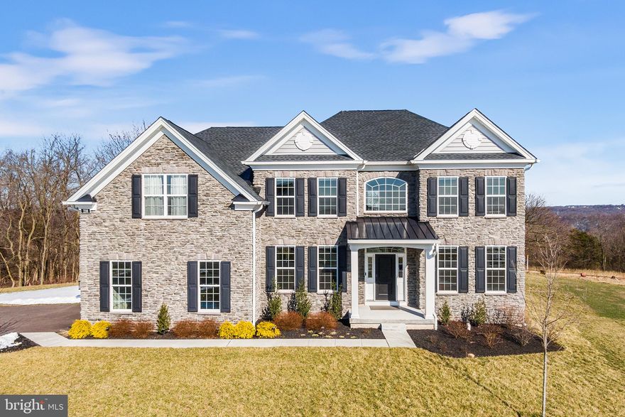 Welcome to 218 Cast Iron Way!  This  stunning, like-new construction 5-bedroom 4-full bath home located in the Estates of Kimberton Glen is a perfect mix of sophisticated style and luxury which complement this fabulous open floor plan  living space.  As you pull into the driveway, the beautiful stone front of the home  and distant picturesque views set the tone for your visit.   Enter the front door to be greeted by the fabulous 2 story high foyer and beautiful winding stair case which leads to the upper level.  An abundance of natural light flows into the home  complimenting the beautiful hardwood flooring throughout the main level.   To the right is a siting area, office or flex space, to the left a very spacious formal dining room .  The foyer leads you  to the stunning Great Room which includes a beautiful  gourmet kitchen with recessed lighting, task lighting,  stainless steel appliances, custom tile backsplash, soft-close cabinetry, quartz countertops, large center island breakfast bar and separate dining area. The kitchen flows into  a large Family Room with vaulted ceiling  and cozy fireplace framed by large windows ensuring an abundance of natural light enters the space as well as  offering a perfect view of the private backyard . A real bonus on the main level is  private office or optional guest bedroom with ensuite bathroom. The laundry/mud room and entrance door to the oversized two-car garage completes the main level. Doors from the kitchen lead out to a large stone patio with outdoor kitchen and flat backyard framed by natural plantings, providing a perfect space for all types of outdoor activities including lots of  room for your future future fire pit area!  The upper level consists of a large Owner's Suite which includes an ensuite bath with soaking tub and shower, large walk-in closet and extra sitting room, which could be used as an office space; three additional bedrooms, one of which has a ensuite bathroom.  A hall bathroom completes the upper level. Looking for additional living space? No problem! The expansive, unfinished lower-level with 9' ceilings offers many options for additional living space. Conveniently located  to parks, shopping, restaurants, entertainment and more. Just minutes to downtown Phoenixville and easy access to Routes 422, 202, and the PA Turnpike. This is a  stunning,  one of a kind property in a fabulous community.  Book your appointment today!