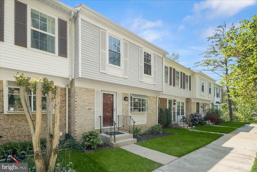 Experience easy, modern living in this stunningly renovated three-level townhome. The brand-new kitchen is a true standout, featuring stainless steel appliances, crisp white cabinetry, elegant quartz countertops, and a charming beadboard backsplash, with plenty of space for an eat-in breakfast table. The kitchen opens to a dining room highlighted by a designer light fixture, which flows seamlessly into the inviting family room featuring a wood-burning fireplace surrounded by striking natural stone. From there, step out onto the new private deck—perfect for relaxing or entertaining. A powder room and coat closet complete the first level.

Upstairs, you’ll find three bedrooms and two full bathrooms. The light-filled primary suite is a masterclass in storage, offering an expansive wall of closets within the bedroom, plus a third closet located off the private en-suite bathroom for ultimate organization. A convenient linen closet in the upstairs hallway provides easy access to additional storage for the entire floor.

The fully finished walkout lower level features a spacious recreation room, a laundry area with ample storage, and a plumbing rough-in for a future bathroom—offering flexibility for expansion. Throughout the home, stylish contemporary finishes create a fresh, welcoming feel, while new carpet in the bedrooms and basement adds comfort. Ideally located in a desirable community with amenities such as tennis courts, a pool, and a neighborhood park.