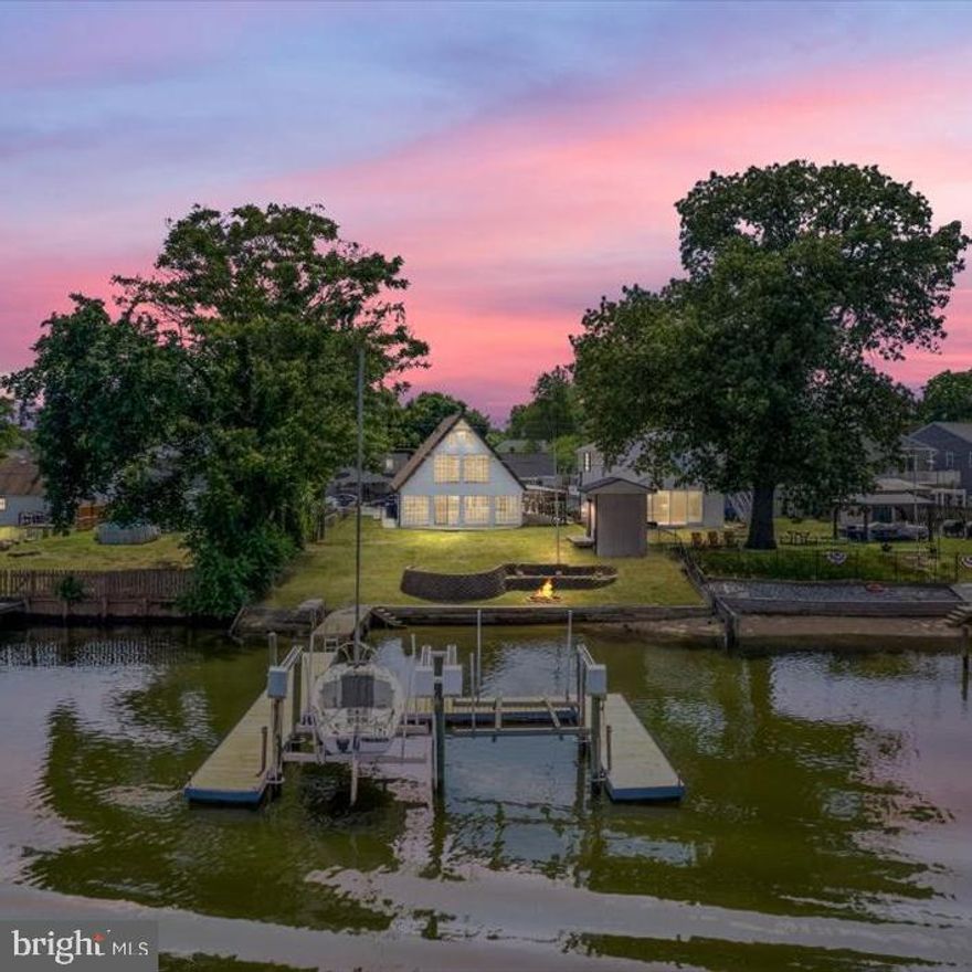 ***Motivated Seller***This is a must see. A waterfront paradise in Baltimore County. The seller has owned and maintained this property since 1993.
      As you enter the front door and walk into the living room you will see the gas fireplace and galley kitchen with stainless steel appliances. To your right is a full bath with 1st floor laundry and 1st floor den which could also be a bedroom.  As you walk through the kitchen into the 20x28 Sunroom you will be astounded by the all glass view of your waterfront. A wet bar and half a bath is located conveniently in that area as well. Just off of the Sunroom are stairs that lead to the second level. Three bedrooms and a full bath are located on this level. In the master bedroom there is a pull down for the attic. In the attic is secret getaway, where you can enjoy some relaxation in your private whirlpool tub. A bonus room is also on this level you can make it a playroom, mini living room or your home office.

The roof is less than 2yrs old. You have 2 driveways and 1 carport. There is enough parking for 5 cars
A new sewage line from the house to the street is about a year old. New flooring and paint throughout the home. A brand new Stainless Steel refrigerator. All other kitchen appliances are Stainless Steel and are  less than 5yrs old. The Washer and Dryer are less than 2 years old. A new floating pier was installed, The pier has electric and water. You will enjoy 2 electric boat lifts with remotes each boat lift can hold up to 8000lbs.  Deep water slips are over 6ft deep with 75ft water frontage that includes a sandy beach with Kayak and Canoe ramp. Quick water access to Inner Harbor, Bay Bridge, Rockhall and Millers Island. Currently no flood insurance is needed the home is not in a flood zone per Baltimore County
Shed with electric and a Fire Pit by the beach.