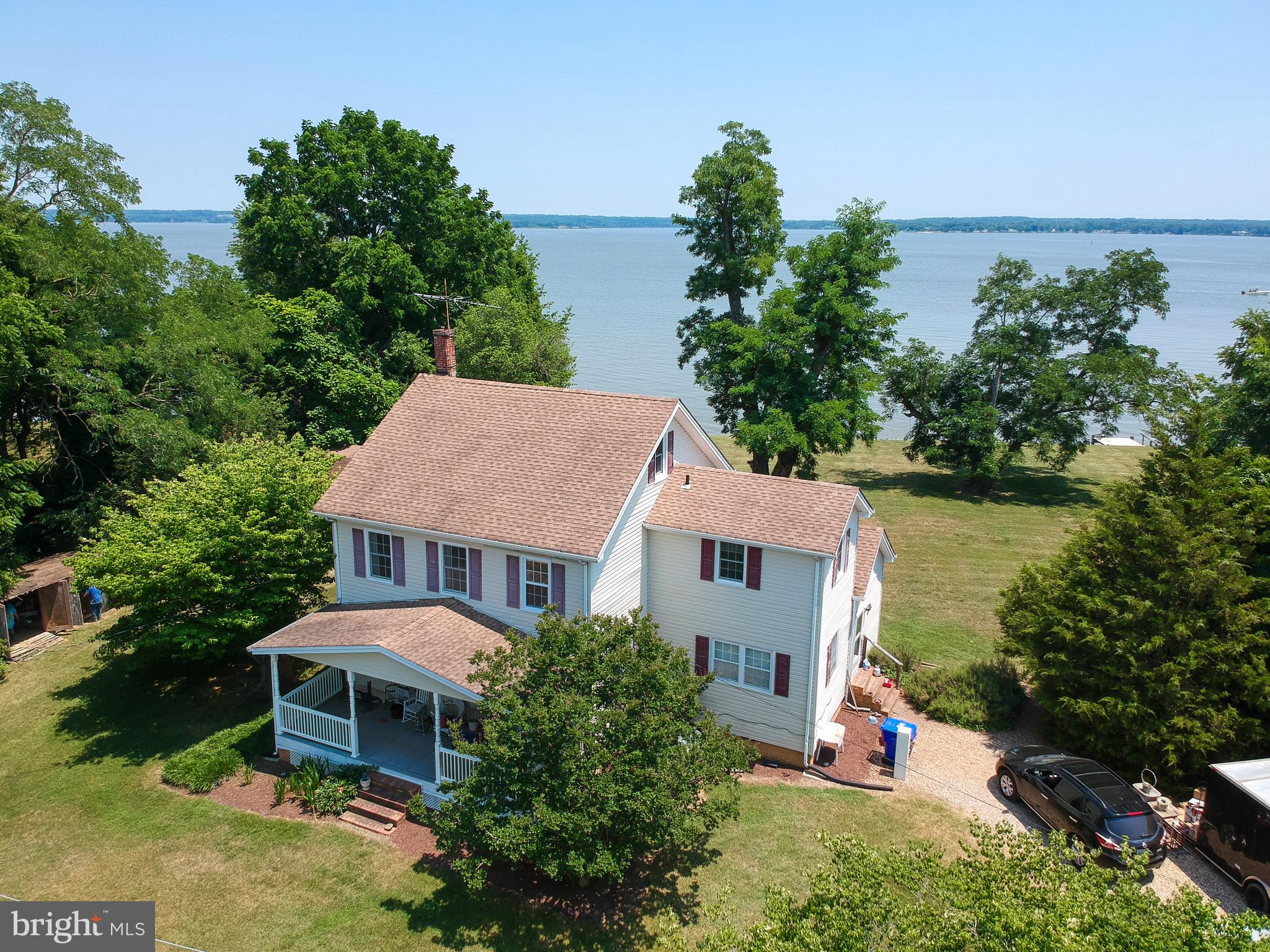WATERFRONT RETREAT: Unique Opportunity to Own 2-Story Colonial Home Situated on 1 Acre +/- Overlooking the Wicomico River. 3 Bedroom/2 Bath Home Features a Spacious Foyer with Beautiful Original Wood Staircase Leading to 2nd Floor, Large Living Room and Separate Dining Room. Riverfront Screened Porch Provides a Quiet Place to Relax or Entertain. Property Offers Existing Bulkhead, Boxwood Gardens, Established Shade Trees and Spectacular View.