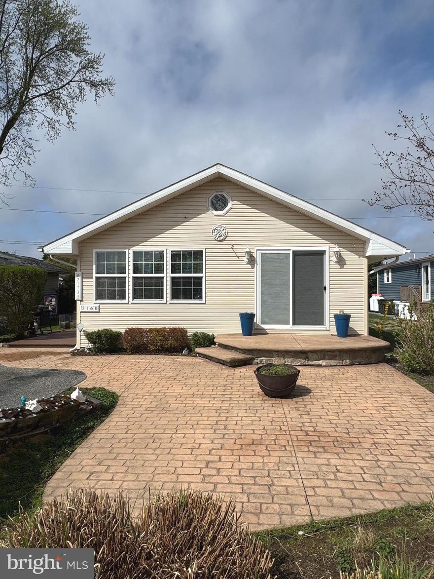 Presenting a fun, beachy home in the desirable, pristine Rehoboth Bay MHP community. This property is ideal for buyers seeking affordable beach living with high-quality finishes and zero maintenance headaches. The flowing floor plan includes three large bedrooms and two full bathrooms, one being in the primary, offering plenty of space for family and guests. Heated floors in the primary bath and whirlpool tubs in both baths. The step down family room provides a comfortable feel. Kayak included, as well. The community provides excellent lifestyle appeal with amenities like playgrounds, community pool and private bay beach. Sports enthusiasts will enjoy the pickleball and tennis courts. Boaters, your paradise awaits: utilize the convenient on-site marina and private boat ramp for seamless access to the water. Whether you're looking for a vacation home or a permanent move to the Delaware coast, this home is move-in ready and waiting for you. Schedule your private tour today!