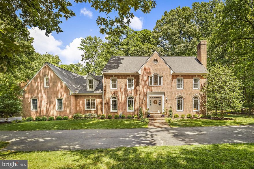 Exclusive Offering in Laurelford — Step into a realm of sophistication and privacy with this prestigious 7000 sq ft Georgian residence, discreetly nestled down a quiet lane from Michaelsford. Constructed by acclaimed local builder Don Huber, this home unfolds over three levels of unparalleled luxury living. The main level is thoughtfully designed with wooded views, featuring a majestic eat-in kitchen and family room. This central gathering space boasts high ceilings and French doors, flooding the area with light and inviting ambiance. Further enriching the first floor are a charming library, an elegant dining room currently serving as a play room, a spacious living room, a dedicated laundry room, a private home office and a chic screened porch, all designed to cater to grand entertaining and intimate gatherings. The residence's private quarters are no less impressive. The second floor features a lavish primary suite with a luxurious bathroom and a sunlit bedroom with stunning expansive views. Enjoy two additional bedrooms with jack and jill bath, a third suite with private full bath, and the ultimate space: a masterfully designed pied-a-terre for guests featuring a kitchenette, a living room with custom built-ins, large bedroom and a stunning full bath all accessible from either the main hall or a secondary staircase. The lower level is a haven for storage and leisure. Outside, the estate offers a seamless blend of indoor and outdoor living with a two decks adjacent the porch, exquisitely maintained gardens perfect for distinguished hosting and private enjoyment. Available exclusively by appointment, this home is a sanctuary of elite living awaiting the most discerning buyer.