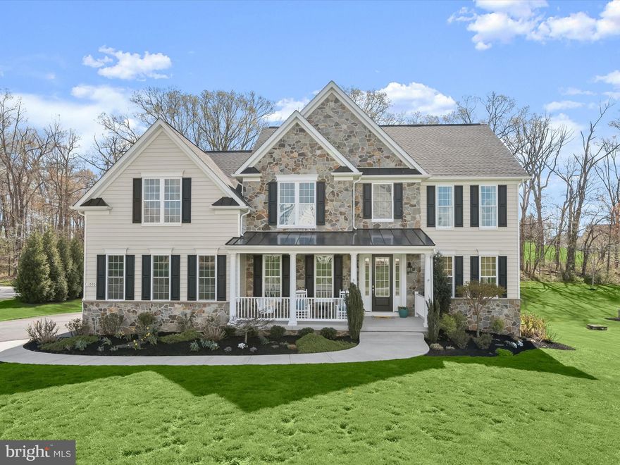 OPEN HOUSE ON THIS HOLIDAY WEEKEND!!! SUNDAY FROM 1PM TO 3PM.
Sellers have done a bang-up job - it sparkles like your favorite Fireworks!!!
Welcome to this exquisite Catonsville Homes Lexington model, a true showpiece nestled on nearly an acre in the highly desirable Cloverfield community. With over 6,000 square feet and stunning architectural details, this home offers luxury living at its finest.
From the moment you arrive, the stone-accented exterior, charming covered front porch, and manicured landscaping set a warm and elegant tone. Step into the grand two-story foyer, where a glass-panel front door with sidelights floods the space with natural light. Rich hardwood flooring, intricate moldings, stylish lighting fixtures, and soaring ceilings create a timeless atmosphere throughout the main level.
To the left, French doors open to a private home office—ideal for remote work or quiet study. To the right, you'll find spacious formal living and dining rooms, both adorned with crown molding. The dining room also features a tray ceiling and chair rail, adding classic elegance for formal entertaining.
The heart of the home is the chef’s kitchen, beautifully appointed with 42” off-white soft-close cabinetry, an expansive center island, granite countertops, and stainless steel appliances, including a gas range and double wall oven. A walk-in pantry, breakfast bar, and sun-filled breakfast room with walls of windows offer comfort and functionality, all overlooking the expansive backyard.
Open to the kitchen, the two-story family room is a dramatic and inviting space, showcasing a coffered ceiling, a floor-to-ceiling stone fireplace, and oversized windows that frame the natural surroundings.
Everyday convenience continues with a finished three-car garage featuring Wi-Fi-enabled doors, a spacious mudroom with custom cabinetry and a built-in drop zone, and a laundry room with utility sink and additional storage. The home is also equipped with a fire suppression system for added peace of mind and is wired for 10 Gig internet—perfect for work-from-home professionals, gamers, or tech enthusiasts.
Upstairs, the primary suite is a luxurious retreat with a sitting room, dual walk-in closets, and a spa-inspired en-suite bath complete with a double vanity, soaking tub, and a frameless glass tiled shower. Three additional bedrooms are generously sized—one with a private en-suite bath and two that share a unique dual-entry style bathroom, offering both privacy and flexibility. The double vanity area connects directly to the bedrooms, while a separate entrance from the hall provides access for guests.
The finished lower level adds exceptional bonus space, including a large recreation room with a walk-out to the backyard, a full bath, a rough-in for a wet bar, and a huge storage room perfect for seasonal items or future expansion.
The outdoor space is a blank canvas awaiting your vision, backing to mature trees that fill in beautifully during summer. This area currently includes a conveying playset, a wonderful walk-in raised garden, and a full-property invisible fence.
With space, style, and serenity, this home combines everyday comfort with refined living—an outstanding opportunity in one of the area’s most sought-after neighborhoods.