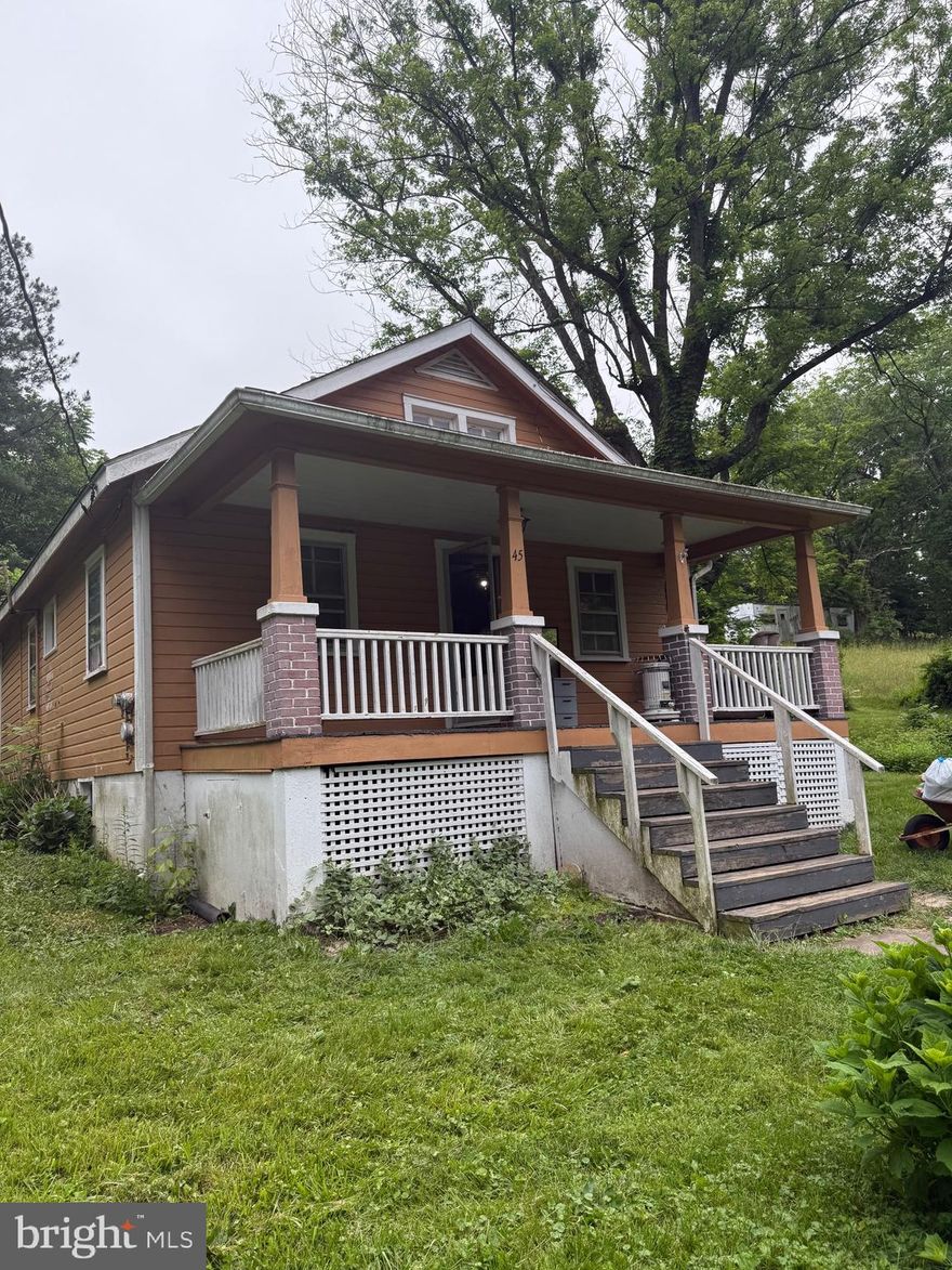Nice little 2 bedroom 1 bath house located right outside of Paw Paw, WV. Home is in need some some work and is being sold strictly AS-IS! New roof installed in 2019, water treatment system installed in 2021, and pressure tank and hot water heater installed in 2019. House has good bones but will need a rehab.