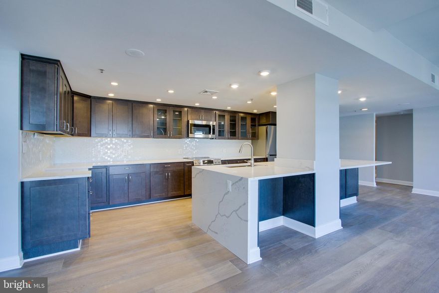 This 2 bedroom / 2 bathroom condominium underwent a COMPLETE remodel this Summer!  Gourmet kitchen with high-end stainless appliances, unbelievably beautiful countertops and backsplash and numerous cabinets that offer you more than enough storage and a built in work space.  Hardwood flooring throughout this wide open floor plan and oversized windows that bring in not only ample sunshine but offer spectacular views of the Inner Harbor.  This residence comes with one premium parking space in a luxury condo building with amenities that include, 24/7 front desk staff, indoor pool, fitness center and more.  Located right where the Inner Harbor / Harbor East and Little Italy neighborhoods meet.   Close to shopping, restaurants, grocery, entertainment and a stones throw to 83!