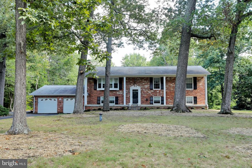 This ALL BRICK large split foyer is situated on large, private , flat lot.  Home features beautiful hardwood floors on main level, 3 bedrooms and 2 full baths, dining room,  kitchen, family room , and covered back porch. Downstairs 2 additional bedrooms (possible) bathroom, recreation room with plumbing and an extra refrigerator with doors to the side of the home and backyard.  2 car garage, shed, beautiful lot with NO HOA, call for a private showing today