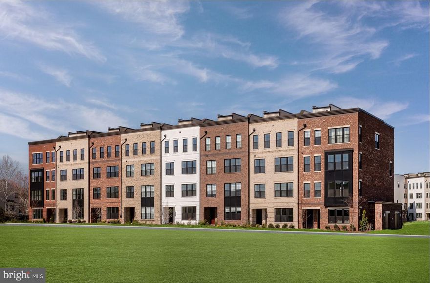 Walkable to Ashburn Metro | The Walney Classic – Move-In Ready Nov/Dec 2025
Live where convenience meets upscale comfort in this beautifully crafted Walney Classic, ideally positioned within walking distance to the Ashburn Metro Station. This home is part of a vibrant, amenity-rich community offering access to a luxurious pool, state-of-the-art fitness center, elegant clubhouse, and a fun-filled playground.
This designer-curated home embraces a modern Art Deco aesthetic with bold finishes and thoughtful details throughout. The gourmet kitchen is a true showstopper, featuring earthy-toned perimeter cabinetry, a dramatic matte black island, quartz countertops with continuous full-height backsplash, and sleek black hardware. Top-of-the-line KitchenAid stainless steel appliances complete the space, making it as functional as it is beautiful.

The upper level is highlighted by a spacious primary suite with a tray ceiling, large walk-in closet, and a spa-inspired ensuite bath boasting a double vanity and an expansive walk-in shower. The laundry room adds everyday convenience with a Whirlpool front-load washer and dryer, built-in cabinetry, and a utility sink.

Entertain in style or unwind in private on the expansive rooftop terrace—a valuable feature that elevates this home even further. With ample space for outdoor dining, lounge seating, and container gardening, the terrace offers panoramic views and year-round versatility. Whether you're hosting sunset cocktails, enjoying quiet morning coffee, or creating your own rooftop oasis, this space is designed to impress.

Additional standout features include an elegant oak staircase, wide-plank luxury vinyl flooring throughout, and a built-in wet bar in the dining area—ideal for hosting, complete with coordinating cabinetry and quartz counters.

Don’t miss this opportunity to own a uniquely styled home in one of Ashburn’s most connected, amenity-rich neighborhoods.