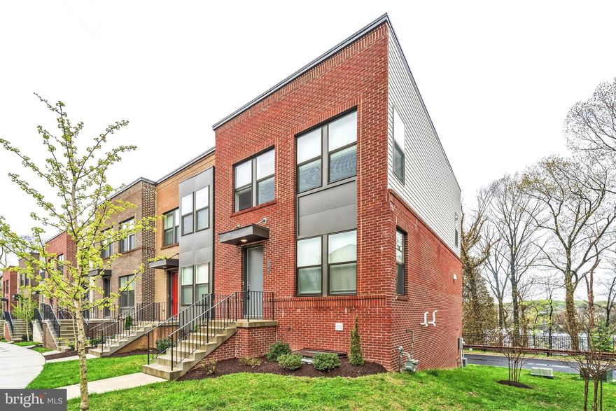 4% in incentives, up to $30,000, towards CLOSING COSTS and/or RATE BUYDOWN when using the seller-preferred lender and title company. Welcome to this beautifully maintained end-unit brick townhome, featuring 3 spacious bedrooms and 2.5 bathrooms. The main level boasts rich wood floors throughout, offering an open-concept design that seamlessly connects the living room, dining area, and kitchen. The kitchen is complete with sleek granite slab countertops, stainless steel appliances, a gas stove, and a central island perfect for meal prep and casual dining. Upstairs, you'll find 3 bedrooms, including the primary suite with its own private ensuite, complete with dual sinks for added convenience. The Laundry is conveniently located near the bedrooms! The lower level provides a versatile den, ideal for an office or additional living space, and offers direct access to the attached 2-car garage. Close to Union Craft Brewing, John Hopkins University, The Rotunda, and fine dining on the Avenue! Available for immediate occupancy! Call now to schedule your showing!