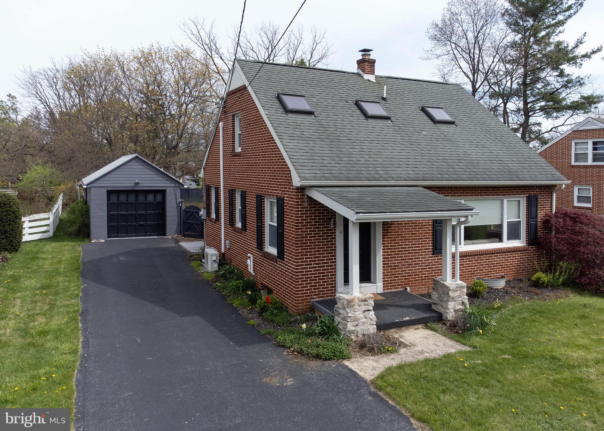 Welcome home to this newly renovated brick Cape Cod in the heart of Carlisle! As soon as you step through the doorway, you are greeted by an open concept kitchen and living room with modern sleek touches throughout . From the wood focal wall with floating shelves to the eyecatching fireplace to the butcher block island to the custom tile backsplash, there is a wow factor everywhere you look! For those looking for one-level living, this home provides a first floor bedroom with a built-in office and a beautiful hallway bathroom. The primary bedroom en suite is located on the second level and feels cozy and private. The sunroom located at the back of the home is bright and airy and provides lovely views of the spacious, fenced-in yard, perfect for enjoying this warm spring weather! Making your way down the wide stairway that accesses the basement, there is plenty of room to add a third bedroom or convert some of the space to a gym, home office, playroom, etc. To add to the allure of this home is the detached one car garage and large walk-in shed. Conveniently located close to the War College, military base, all the restaurants and shopping in the downtown area of Carlisle, plus a quick drive to Routes 641, 81, and the PA Turnpike, this charming Cape Cod offers affordability combined with curb appeal and central location. Don't delay, make this home your own today!