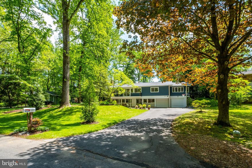 Stunning renovation and expansion of this Overlook Model in  beautiful Carderock Springs, the DC area's preeminent mid-century modern neighborhood. In the quietest part of Carderock, on a premium, level, landscaped lot with great privacy and wonderful outdoor spaces this home was completely renovated in keeping with the mid-century modern style. Light-filled with incredible indoor and outdoor spaces,  it has the perfect flow for entertaining and family living and beautiful views from every window. The stunning gourmet kitchen was expanded and opened up to the dining and living spaces creating a "great room" with fireplace and  a very flexible floor plan and an island with seating area. The design provides great work flow and ample built-in storage with high end finishes, lighting and appliances.  Family and friends can gather in the adjoining sitting area or work together around the island, all with beautiful views out a wall of glass to the garden. The great room flows out both to a balcony with cable railing overlooking the private and park-like front garden and also to a large brick paver patio overlooking the stunning, rarely available in Carderock,  large level 22,000 sf lot with ample lawn area, a treed view and stunning modern screened porch house with seating and dining space and four sides of screen. Upstairs you find a beautifully expanded primary bedroom with sitting room and a luxurious spa-like primary bathroom with deep soaking tub, modern hardwood double vanity, and generous walk-in shower with frameless glass enclosure. The primary suite is completed by a fitted walk-in closet. Two more excellent bedrooms and a beautifully renovated hall bath complete this level.

On the walkout lower level you have a generous foyer with closets, a terrific family room with second fireplace, lovely bright bedroom with full renovated bath, large utility room with laundry and storage and a deep and wide 2 car garage (a nice bonus in Carderock!). 

This home has had so many major renovations in the last 5-6 years in addition to kitchen and baths you have a new roof and gutters (covered), many windows, skylights, water heater,++++

Thoughtfully planned to nestle the homes in the beautiful landscape with gently winding streets, it is a joy to walk through Carderock-- indeed you see neighbors walking and kids biking throughout the neighborhood to see friends, to the swim and tennis club (active swim, tennis and camp programs) and to award-winning Carderock Springs Elementary. There is a "free library" with bench on Fenway near the corner of Still Spring. Indeed Carderock Springs is a neighborhood designed to gather with family and friends. There are numerous activities at the clubhouse which is a short walk via the shortcut on Still Spring Court (exercise classes, Chatauqua program of talks, art shows, cook-offs and more), fourth of July and Halloween events, and block parties are regularly held. There are lovely wooded trails in the parkland adjoining the neighborhood. Visit the Carderock Springs website for much more information about this delightful neighborhood!

You are so close to the C and O Canal, Cabin John with it's restaurants, grocery, post office, salon and spa, gym and more. Just down MacArthur via the bike path is Glen Echo park with its classes for adults and children, camps, music festivals and arts events. Commuting options to Bethesda, downtown, the 270 corridor and Northern VA are plentiful making this a wonderfully convenient place to live and take advantage of all the DC area has to offer.