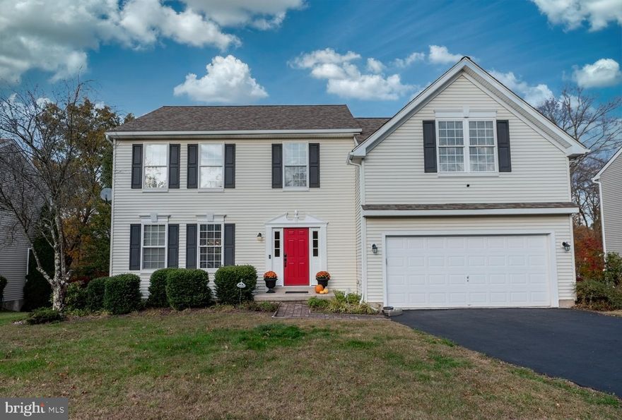 Welcome to the delightful Chestnut Grove community, where sidewalk-lined streets and classic architecture create a warm, neighborhood feel. Step through the custom front door into a gracious foyer, flanked by a formal living room that flows seamlessly into the spacious dining room—perfect for hosting gatherings. The first floor features 9-foot ceilings and gleaming hardwood floors that carry through the foyer, kitchen, and family room. The gourmet kitchen impresses with granite counters, tile backsplash, center island, gas cooking, pantry, stainless steel appliances, and built-in microwave. It opens beautifully into a two-story family room with cathedral ceilings, double skylights, and a cozy gas fireplace. From here, sliding glass doors lead to an expansive composite deck overlooking a private backyard oasis—ideal for relaxing or entertaining. Upstairs, the primary suite offers abundant natural light, a large walk-in closet, and a luxurious en-suite bath with dual sinks, soaking tub, and brand-new shower. Three additional spacious bedrooms and a hall bath complete the second floor. The daylight walk-out basement provides even more living options with multiple finished areas—an office, studio, or fitness room with interior window views, a potential fifth bedroom with walk-in closet (or future full bath), plus a large open space perfect for a media room or man cave. A walk-out slider opens directly to the backyard. All of this in a prime location just minutes to Routes 100 & 422, shopping, dining, and the Philadelphia Premium Outlets—Chestnut Grove living at its finest!