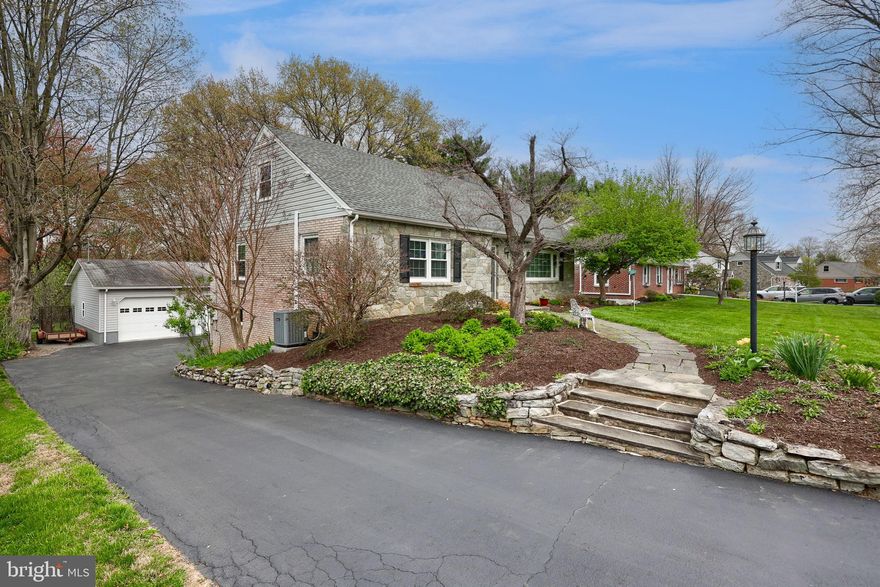 Welcome home to this timeless and charming stone Cape Cod in the Bloomingdale neighborhood. This home is filled with warmth and character throughout. Upon entering, you’ll notice the beautiful hardwood pegged floors in the foyer, living room, and dining room. The living room features a stone-front, wood-burning fireplace with a mantel, while large windows fill the space with natural light. The updated kitchen includes new cabinetry with under-cabinet lighting, recessed lighting, a gas stove, and a cozy breakfast area. The first-floor primary suite offers hardwood floors and a private ensuite bath with tile flooring, a step-in shower, and convenient laundry. Also on the main level is a three-season enclosed porch—perfect for relaxing afternoons or quiet evenings. Upstairs, you’ll find two spacious bedrooms, a full bath, and generous attic eave storage. The full daylight lower level features a finished family room with a second wood-burning fireplace and a half bath additional storage and 1 car garage.  Outside, the beautifully landscaped yard enhances the home’s appeal. The large deck is perfect for grilling and enjoying those cool evenings with friends.  The 28'X28' oversized two-car garage completes this exquisite home. The garage has a 10 ft ceiling perfect for your boat storage.  Included in the garage is a workshop area and pull-down stairs to storage above. This exceptional home has been meticulously cared for and is ready for you to call it home. New A/C installed April 2026