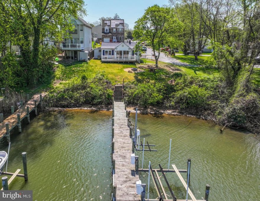 Waterview rancher offering the perfect blend of comfort and coastal charm. The inviting living room showcases a cozy pellot stove, while the primary suite offers a skylight and private full bath. Two additional bedrooms and a second full bath complete the main level.
The unfinished basement provides ample space for storage, utilities, and a dedicated laundry area.
Step outside to relax on your deck and take in peaceful water views, or head down to your private pier for easy access to the water. 
Recent updates include fresh paint, new flooring kitchen & living room.  Located in a water-privileged community with non-riparian rights, residents enjoy access to a boat ramp, community pier, beach, picnic area, and tot lot ). A rare opportunity to enjoy waterfront living without the waterfront price.