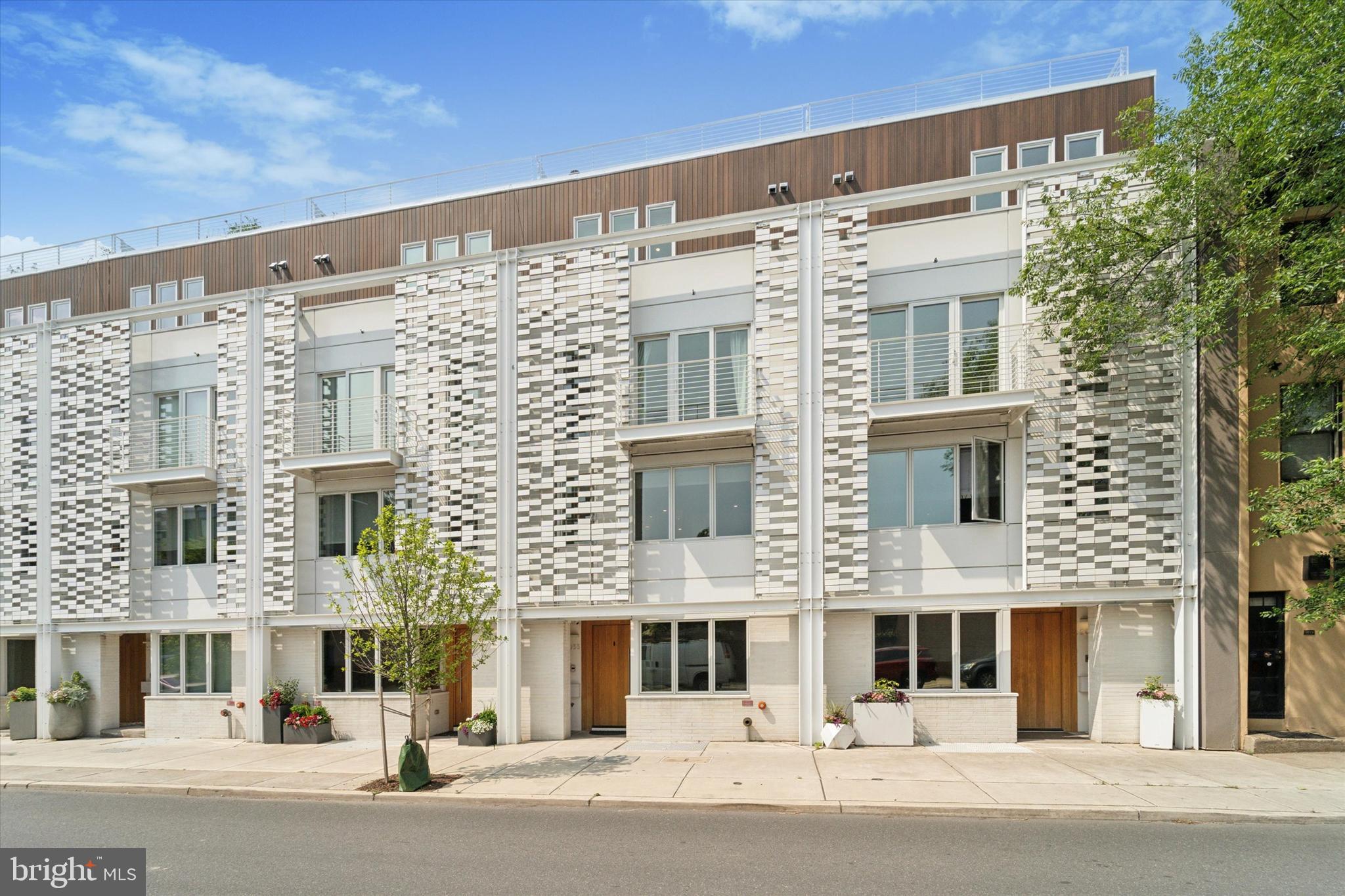 Luxury in Rittenhouse: Approx. 4,500 sq/ft, tax abatement until Feb of 2031, loads of parking, 2 outdoor decks PLUS a full-length rooftop (w/ 5-person spa, outdoor TV & incredible skyline views). Elevator w/ 6 stops, Italian Marble custom built-ins & cabinetry, fireplace, CAT-6 wiring, WiFi access points through house & hard-wired tablets to control in-ceiling speakers, HVAC, door locks, lights, high def security cameras & smart features. Permitted curb-cut with long driveway leading to a 2-car garage. Located in the coveted Greenfield School District & garage access is off of the peaceful & quaint Addison Street. Upon entry, you’re greeted by a stylish office with sliding glass doors. A powder room & coat closet add convenience to this level. Hose bibs in front of home & in garage.
The second floor is an open concept kitchen, living & dining area w/ in ceiling speakers, a hard-wired control 4 tablet for smart home features, recessed lighting, remote controlled custom blinds, a soaring ceiling & a beautiful chandelier. Custom full-length living & dining built-ins (2024) w/ Italian Palissandro Marble counters, hearth & surrounding the fireplace. Built-ins include a hidden fridge, wine fridge, beverage fridge, pocket doors for the bar & sink, & an antique glass mirror, adding a touch of elegance. Mendota Fireplace with multiple fan & flame settings & automatic room heating to your desired temp. 65" Samsung Frame TV. Access to a large outdoor porch w/ composite decking, allows for entertainment & outdoor meals. Chef’s kitchen is equipped w/ Wolf & Sub-Zero appliances, convection oven, Bosch dishwasher & a large kitchen island. Hidden pantry w/ Italian marble countertops serves as a sophisticated coffee station. A powder room completes this level. The third floor features two bedrooms, each w/ walk in closets, custom remote-controlled shades & en-suite full baths (one w/ a tub & shower, one w/ walk-in shower). Private balcony off of the south facing bedroom. Custom trim in the other. Additional space in the hallway can be utilized as an office, den or gym. The laundry room is tucked behind pocket doors, & features Whirlpool washer & dryer, sink, & custom cabinetry. On the next level, the expansive primary suite offers over-sized custom closets, chandeliers, quartzite vanities & a beautiful skyline view seen from bed. Custom blackout shades. The primary bath features in-ceiling speakers, a frameless glass shower, a soaking tub, double vanity, quartz counters, heated floors & custom shades. A hardwired tablet to control security, music, lights & smart features is located in the master. An additional powder room serves guests utilizing the rooftop above, maintaining bedroom privacy, even when entertaining. The rooftop is full-length porcelain tiled, plenty of electric outlets & a hose bib. Gas lines are in place (behind paneling) for an outdoor grill. Terrace outdoor TV w/ hardwired speakers & 5-person Envoy Hot Springs tub, where you can enjoy the skyline. Private seating (or gardening area) on the south side of pilot house.
Finished basement offers an additional bedroom w/ an en-suite bathroom & frameless glass shower. Basement Media room w/ in-wall & ceiling surround sound speakers & 85 inch Sony TV —ideal for movie nights. The media room has a wet bar w/ natural stone countertops, a fridge, sink & shelving. Multiple storage closets, utility closet & dedicated server closet & rack. Additional: Elevator serves all 6 levels, 4-zone HVAC, upgraded security cameras, WiFi hotspots through home, cat 6 wiring, curb-cut w/ long driveway to 2 car garage, extra thick dry wall, alarm system, sprinkler system. Over $250k in upgrades since 2021. Within walking distance from UPenn, CHOP, Fitler & Rittenhouse Square, the Schuylkill River Trail & top dining, shopping & entertainment. 2033 Lombard has it all. Schedule your private showing today & experience this exceptional townhome in one of Philadelphia’s most desirable neighborhoods!