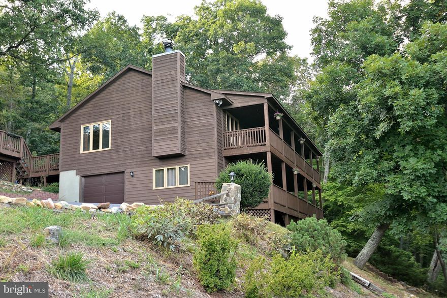 Amazing views! An incredible 3.75 acres! Rich hardwood floors, fireplace & vaulted wood ceiling in great room. Kitchen w/SS appliances, large island, breakfast bar, maple cabinets & hardwoods. 2 master BR suites w/full baths. Expansive lower level w/wood stove and walk out. 2 great full length decks along front of home & terrific rear deck w/hot tub & gazebo.