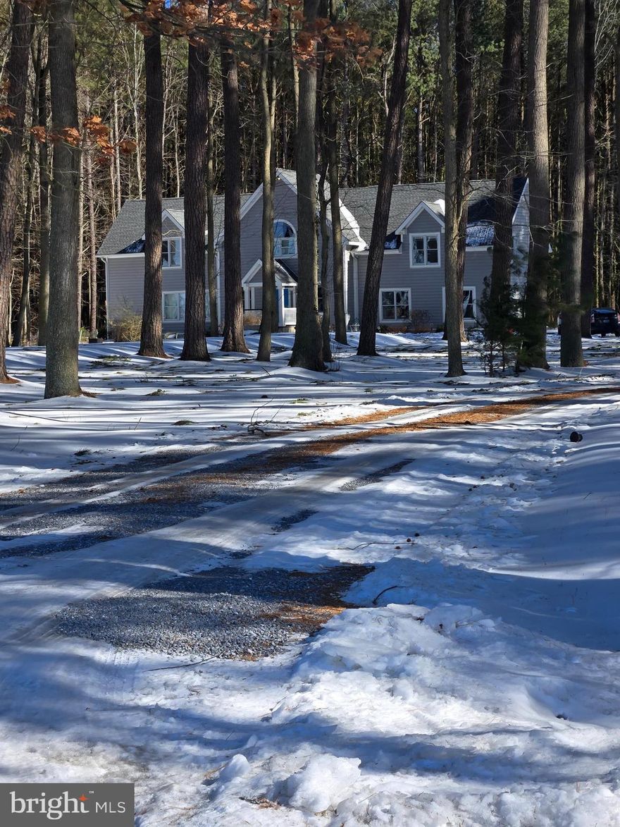 Tranquility abounds with this jewel nestled in pine trees with westerly sunset water views of the Choptank River.  This home was built with tons of extra amenities from top to bottom.   From the moment you step inside you are greeted with a spacious foyer and gleaming hardwood floors.  Enjoy cooking in your gourmet kitchen with granite countertops, double wall ovens, island, six burner gas stove cooktop, built-in microwave, stainless appliances and top of the line cherry cabinetry.  This flows to the Family Room with a beautiful gas fireplace to keep you cozy on those chilly nights.  Kitchen and Family Room have cathedral ceilings, large windows for lots of natural light and sliders that lead to the patio.  A formal dining room offers plenty of room for family dinners.  There is a primary bedroom on the first floor with separate sitting room and jacuzzi/whirlpool tub, shower and double vanities in master bathroom.  Three additional bedrooms upstairs plus a bonus room that could be used as an in-law suite, office, game room, bonus room, man cave, etc.  Another family room upstairs to relax with great water views.  Laundry area on both floors for your convenience.  This house boasts over 3400 sq. ft. of living space which makes it great for entertaining.  
So, if you're looking for an escape from all the hustle and bustle, this offers it all.  Peace, serenity, nature and incredible water views on over 2 acres with lots of privacy and just minutes from Cambridge.  No flood insurance required.