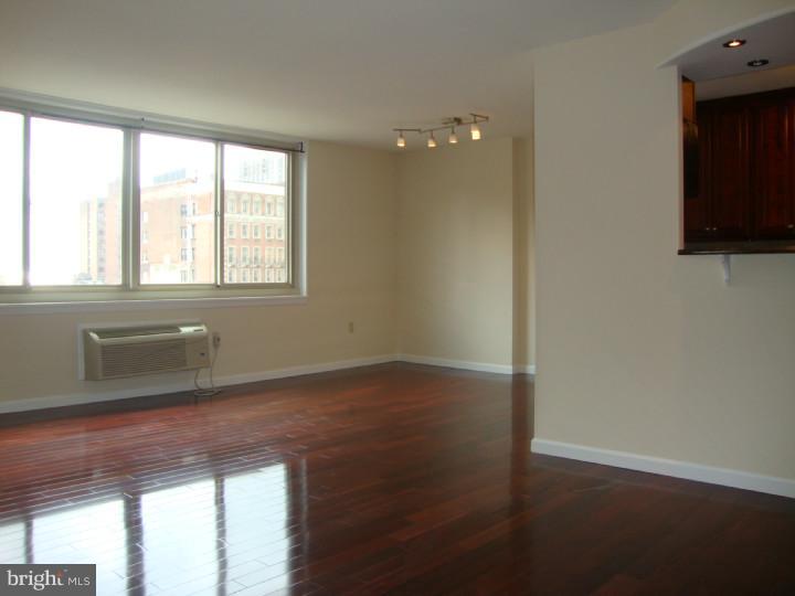 Large 2 bedroom 2 bathroom CO-OP apartment for sale in Philadelphia. This is a 9th floor corner unit in a secure building located two blocks off Rittenhouse Square. This unit faces south w/great views towards Rittenhouse Square Park. The entrance leads to a large open living room w/dining area and large open kitchen with Granit Counters, Stainless steel appliances and breakfast bar. The impressive master bedroom includes a gorgeous en suite bathroom with tiled shower and vanity with granite counter. There is plenty of storage for your wardrobe in several reach in closets. The second bedroom faces east and has views of the city. The main living areas had dark hardwood floors and the bedrooms are carpeted. Also included in this unit is laundry closet with stackable washer and dryer. The monthly CO-OP fee includes all utilities, basic cable and real estate taxes. The fitness center is $60. per year. The roof top pool is $100 per season. Parking is available for this unit at $80. per month.