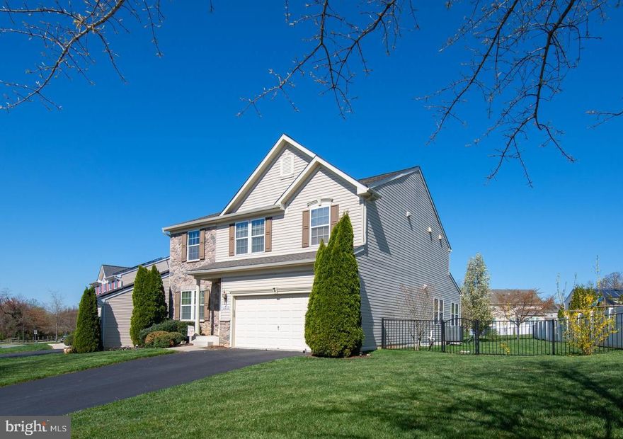 Beautiful, stone front colonial nestled on premier lot backing to open space in Fields of Rock Glenn community. Home has 2688 sq. ft. above grade. Home is loaded with upgrades including bonus morning room overlooking pristine, fully fenced yard. Gourmet kitchen with granite counters, huge island  and 42" cabinets. Large 20' x 15' family room with gas fireplace and new carpet. Hardwood floors on the rest of main level. 21' x 15 primary bedroom with upgraded owner's bath including soaking tub and large shower and walk in closet. Upper level also has 2nd family room. Lower level has walkout stairs and is fully finished with 25' x 21'recreation room, full bath and additional room being used as 4th bedroom. New architectural roof recently installed. High efficiency, gas furnace and AC less than 2 years old. Within 5 miles of commuter rail. APG and 1-95. Home is in pristine condition.  10+++