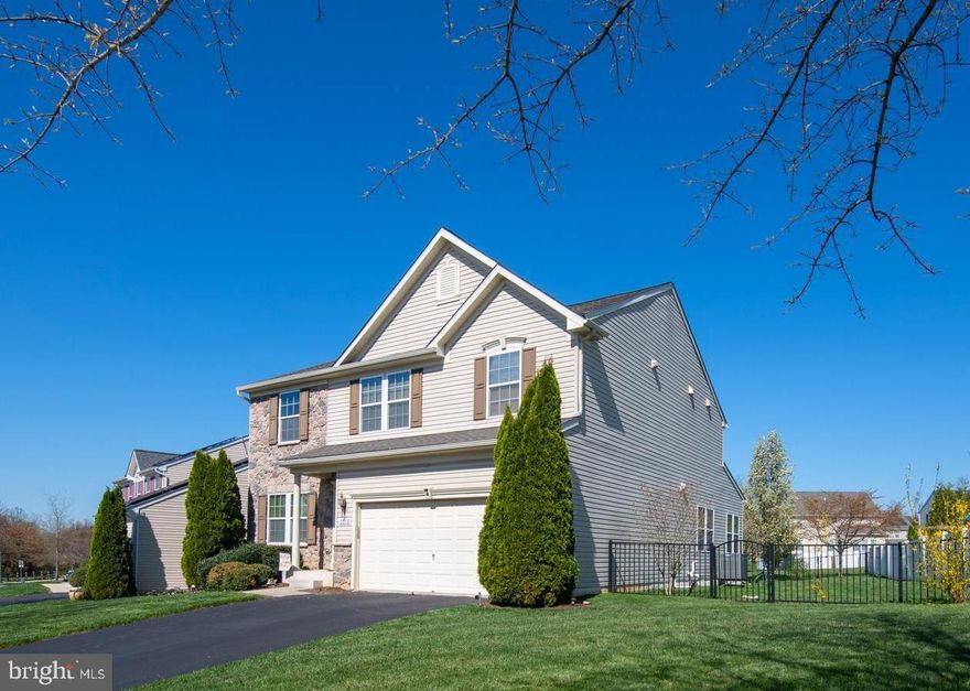 Beautiful, stone front colonial nestled on premier lot backing to open space in Fields of Rock Glenn community. Home has 2688 sq. ft. above grade. Home is loaded with upgrades including bonus morning room overlooking pristine, fully fenced yard. Gourmet kitchen with granite counters, huge island  and 42" cabinets. Large 20' x 15' family room with gas fireplace and new carpet. Hardwood floors on the rest of main level. 21' x 15 primary bedroom with upgraded owner's bath including soaking tub and large shower and walk in closet. Upper level also has a bonus, 2nd family room. Lower level has walkout stairs and is fully finished with 25' x 21' recreation room, full bath and additional room being used as 4th bedroom. New architectural roof recently installed. High efficiency, gas furnace and AC less than 2 years old. Within 5 miles of commuter rail. APG and 1-95. Home is in pristine condition.  10+++