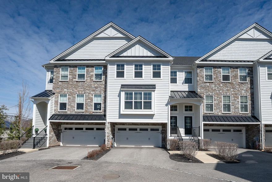 Nestled in the heart of Lafayette Hill and within the highly
sought-after Colonial School District, this stunning 6-year-old
townhome blends modern design with everyday comfort. From the moment
you step inside, you’re greeted by an inviting, open-concept first
floor featuring soaring ceilings, gleaming wood floors, and sunlit
spaces thanks to oversized windows with multiple exposures.

The first floor also boasts a large, airy living room—a perfect spot
to relax or entertain. With its seamless flow, this space is ideal for
cozy movie nights, hosting friends, or simply enjoying the natural
light that pours in through the windows.

The chef’s kitchen is a showstopper, boasting a substantial quartz
island that’s ideal for cooking, entertaining, or gathering with
friends. Custom wood cabinetry, sleek stainless steel appliances, and
thoughtful finishes elevate the space. Just beyond the kitchen,
sliding glass doors lead to a spacious elevated Trex deck where you
can unwind with sweeping views of preserved land and a serene walking
path—perfect for al fresco dining or morning coffee. Rounding out the
first floor is a sizable dining area and a chic powder room.

Upstairs, the primary suite is a true retreat, complete with a custom
walk-in closet, elegant tray ceiling, and a luxurious en-suite bath
featuring a double-sink vanity and marble shower. Two additional
bedrooms with generous closets, a stylish full hall bath, and a
convenient laundry room complete the second level.

The lower level offers incredible flexibility with a versatile bonus
room that can serve as a fourth bedroom, home office, gym, or family
room. A half bath and a pristine garage with epoxy flooring add the
finishing touches to this exceptional home.

With its unbeatable location (walking distance to restaurants, retail
and public transportation), contemporary features, thoughtful layout,
and situated in the Colonial School District, this home is ready to
impress. Don’t miss your chance to experience modern living in
Lafayette Hill.

Showings start Saturday April 11, 2026- don't wait- schedule your appointment today!