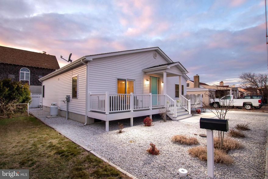 Experience effortless one-level coastal living in this beautifully maintained 3-Bedroom, 2-Full Bath Rancher built in 2022 and gently lived in. Located in a prime spot in Ocean City, just one block from the beach, this low-maintenance home with NO HOA offers the perfect blend of modern comfort and seaside convenience.

Step inside to an inviting open-concept layout highlighted by vaulted ceilings in both the main living area and the spacious primary suite, creating an airy, light-filled atmosphere. Durable, water-resistant luxury vinyl plank flooring flows throughout the home, ideal for easy coastal living.

The chef’s kitchen is the heart of the home, featuring high-end soft-close cabinetry with extensive storage, stunning quartz countertops, stainless steel appliances, and a large island with a farmhouse sink—perfect for entertaining family and friends after a day at the beach.

The primary suite offers a private retreat with sliding glass doors leading directly to the rear composite deck. Enjoy a large walk-in closet, double sinks, and a beautifully designed walk-in shower with built-in seating. The upgraded hall bath adds additional style and comfort for guests.

Outdoor living is just as impressive with a welcoming front porch finished in composite decking and a spacious rear deck—also composite—for relaxing or hosting summer gatherings. Multiple rear storage sheds provide ample space for all your beach gear, bikes, and outdoor essentials.

Additional highlights include a front-loading washer and dryer, pull-down attic stairs for added storage, soundproof insulation and thoughtful upgrades throughout.

Just steps from the sand, this move-in-ready coastal gem offers the ultimate beach lifestyle.

Check out the 3D virtual tour and schedule your private showing today!
