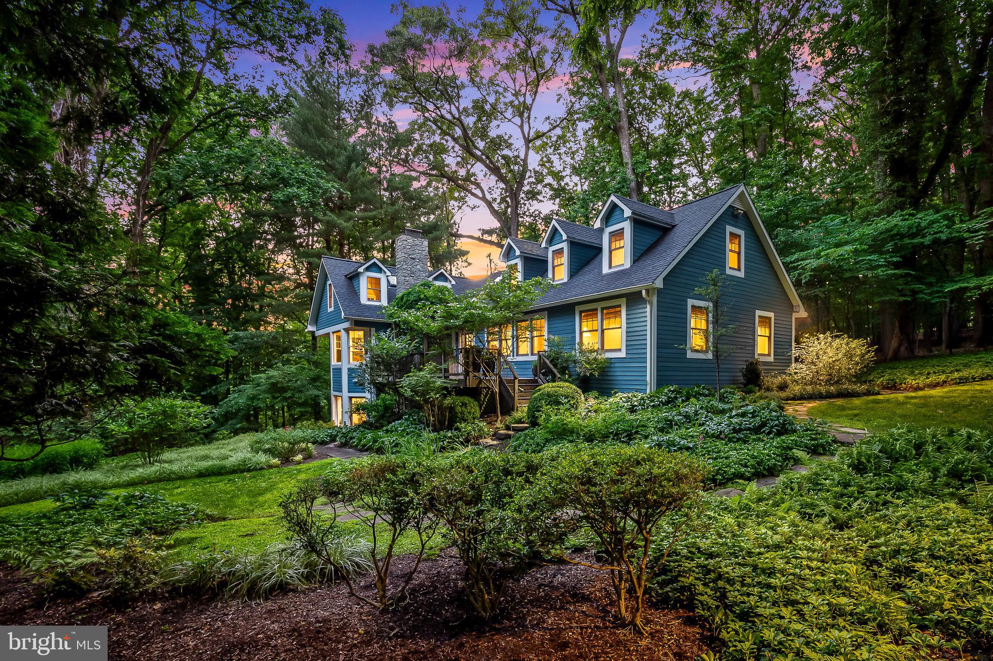 Retreat to your private oasis in Greenspring Valley and enjoy nature's bounty! Situated up a long private drive, you are just seconds to Greenspring Station, the Quarry, 83 and local private and public schools but you are home, and surrounded by natural beauty. Nestled on 1.45 acres of exquisitely landscaped grounds (Bob Jackson, landscape designer) and backing to 32 acres of conservation land donated by prior neighbors to the Maryland Environmental Trust in order to limit future development along the ridge of Hillside Road in Stevenson, what started as a 1931 cottage has been thoughtfully expanded over the years and is a thoroughly enchanting blend of modern conveniences and rustic charm. Evoking a feeling of vacation living at home, this 4 bedroom,4 full/1 half bathroom home is accessed via a winding walkway through a lush secret garden with natural wonders that change with the seasons. Several Azek and ipe decks with custom copper balusters offer stunning views and enjoyment of this beautiful place of serenity year-round. The entry level has a large bedroom, full bath, formal dining room and great room opening to a cook's kitchen featuring custom Rutt cabinetry and granite countertops. A newly constructed mudroom and pantry offer convenience for children, pets and adults to enjoy the surrounding property. Both 2nd floor bedrooms have built-in desks and the above grade, walkout lower level is a welcome surprise with a bright family room and 4th bedroom awash in natural light along with a cheerful newly renovated laundry room and new full bath. The exterior entrance and deck on this level offer flexibility for those needing in-law or au-pair accommodations. Well-maintained and carefully updated with top of the line materials and systems, this one is sure to please! No expense has been spared in this thoughtful renovation.
