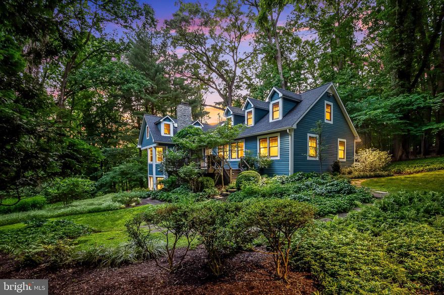 Retreat to your private oasis in Greenspring Valley and enjoy nature's bounty! Situated up a long private drive, you are just seconds to Greenspring Station, the Quarry, 83 and local private and public schools but you are home, and surrounded by natural beauty. Nestled on 1.45 acres of exquisitely landscaped grounds (Bob Jackson, landscape designer) and backing to 32 acres of conservation land donated by prior neighbors to the Maryland Environmental Trust in order to limit future development along the ridge of Hillside Road in Stevenson, what started as a 1931 cottage has been thoughtfully expanded over the years and is a thoroughly enchanting blend of modern conveniences and rustic charm. Evoking a feeling of vacation living at home, this 4 bedroom,4 full/1 half bathroom home is accessed via a winding walkway through a lush secret garden with natural wonders that change with the seasons. Several Azek and ipe decks with custom copper balusters offer stunning views and enjoyment of this beautiful place of serenity year-round. The entry level has a large bedroom, full bath, formal dining room and great room opening to a cook's kitchen featuring custom Rutt cabinetry and granite countertops. A newly constructed mudroom and pantry offer convenience for children, pets and adults to enjoy the surrounding property. Both 2nd floor bedrooms have built-in desks and the above grade, walkout lower level  is a welcome surprise with a bright family room and 4th bedroom awash in natural light along with a cheerful newly renovated laundry room and new full bath.  The exterior entrance and deck on this level offer flexibility for those needing in-law or au-pair accommodations. Well-maintained and carefully updated with top of the line materials and systems, this one is sure to please! No expense has been spared in this thoughtful renovation.