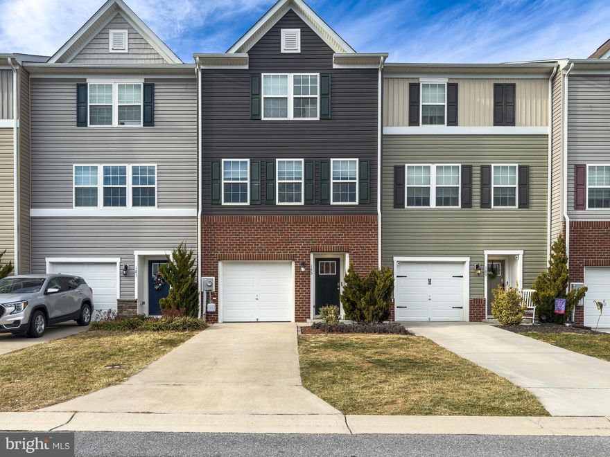 Nestled in the charming Berkeley Ridge community, this exquisite townhouse offers a perfect blend of modern comfort and inviting warmth. Built in 2020, this Colonial-style home features a spacious open floor plan, ideal for both relaxation and entertaining. The heart of the home is the family room that seamlessly connects to the kitchen, adorned with upgraded countertops and equipped with essential appliances, including a self-cleaning oven, dishwasher, and refrigerator. With three generous bedrooms and two and a half bathrooms, this residence provides ample space for everyone. The fully finished basement, complete with a walkout level, offers additional living space or a perfect retreat. Enjoy the convenience of upper-floor laundry and a security system for peace of mind. Step outside to discover a lovely deck and patio, perfect for outdoor gatherings, while the community amenities include scenic jog/walk paths and well-maintained common grounds. The neighborhood is enhanced by its proximity to parks, schools, and a commuter rail station within five miles, making it an ideal location for those seeking both tranquility and accessibility. With sidewalks lining the streets and an attached garage for easy parking, this home is not just a place to live, but a place to thrive. Experience the warmth of community living in Berkeley Ridge, where comfort meets convenience.