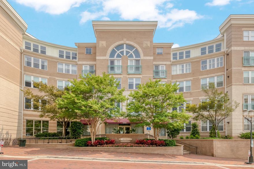 Welcome home to this beautifully remodeled 2-bedroom, 2-bath condo in the highly sought-after Market Street at Reston Town Center! Step into the modern kitchen, where crisp white cabinetry, brand-new stainless steel appliances (2024), ample counter space, and a generously sized pantry make cooking and entertaining a delight. The open floor plan seamlessly connects the kitchen to the family room, featuring updated flooring throughout and direct access to a private balcony overlooking the serene courtyard.

A versatile den just off the kitchen offers the perfect space for a home office, gym, or playroom. The sunlit primary suite boasts newer carpeting (2022), a stylishly updated en-suite bath, and a spacious walk-in closet with custom organization (updated in 2022) for exceptional storage. The second bedroom provides en-suite access to the second full bath, featuring elegant porcelain tile, updated lighting, and a modern vanity. In unit dedicated laundry room with extra storage and an upgraded washer and dryer (new in 2022). Recent updates throughout the unit include fresh paint (2023-2025), newly installed window blinds (2025), and a tankless water heater (installed in June 2022). Beyond the countless interior upgrades, this condo comes with two dedicated parking spaces in the secure, covered garage—perfectly positioned for convenience. Enjoy the vibrant lifestyle of Reston Town Center with its incredible shopping, dining, and entertainment options, all just moments from picturesque lakes, parks, and trails. Welcome home!