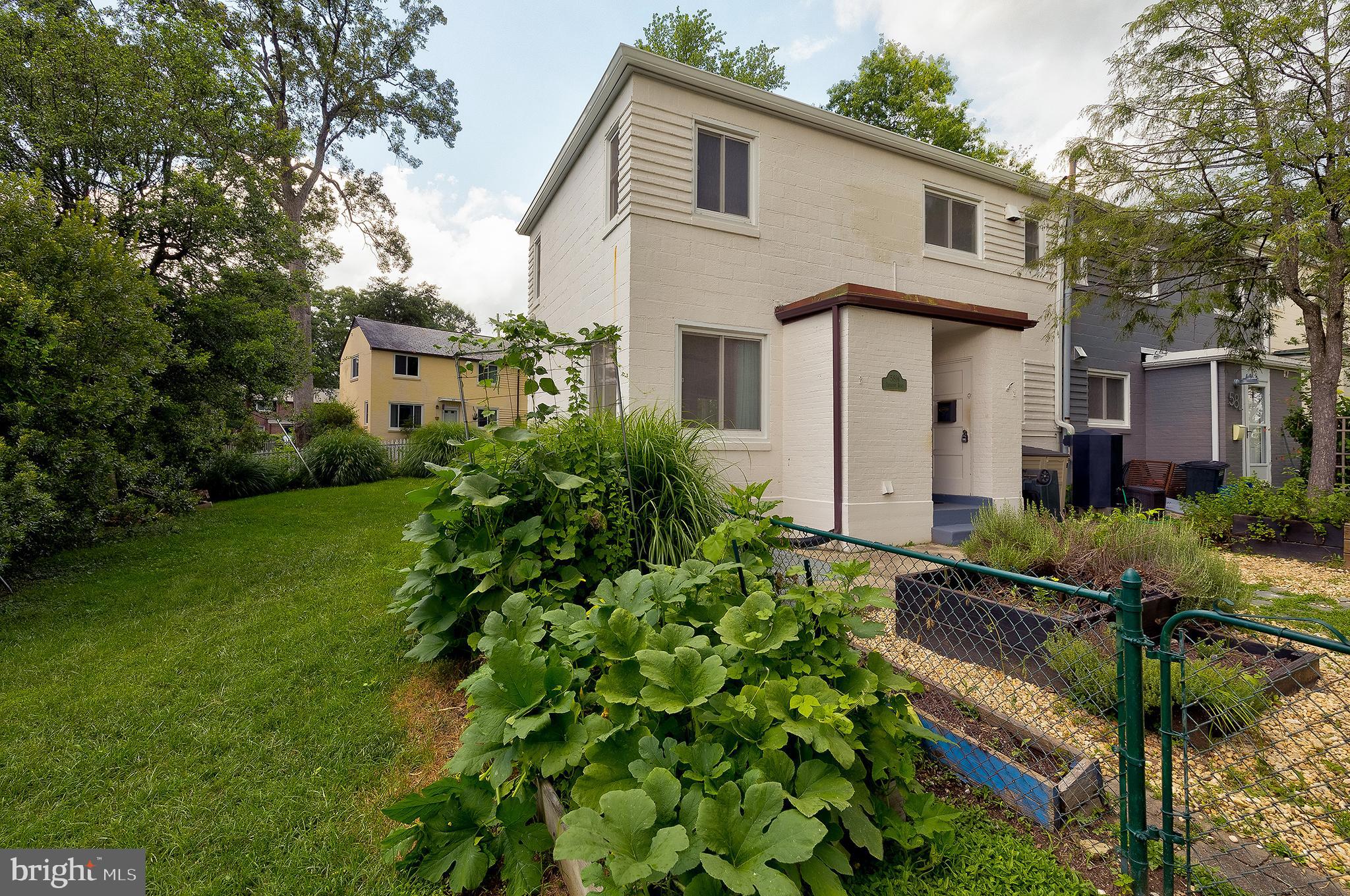 This charming end-unit Co-op with garden-ready yard is a rare find in the heart of Historic Greenbelt. The art-deco townhome has bright southern light, landscaping designed for extra privacy, and a spacious yard already set up for home gardening. Raised beds, trellises, and mature herbs are ready to go, with plenty of space for your next harvest of tomatoes, squash, or local flowers. Inside, this well-maintained home features vintage GHI cabinetry, a freshly reglazed tub, new bathroom tiling, and modern high-efficiency mini-split systems for year-round comfort. The main level includes a sunny living room with windows on three sides, a separate dining room, and a compact but functional galley kitchen. Upstairs, you’ll find two full bedrooms plus a third room perfect for a home office, guest room, or nursery.
This home is part of the unique and historic Greenbelt Homes (GHI) co-op community. The monthly co-op fee covers property taxes, structural maintenance, insurance, plumbing and electrical maintenance, and more—making budgeting easier and homeownership more affordable. The home is a short walk to the New Deal Cafe, Roosevelt Center, the Greenbelt Aquatic and Fitness Center with both indoor and outdoor pools, Greenbelt Lake, grocery store, multiple dining options, and the Sunday farmer’s market.
Learn more about the GHI experience at ghi.coop. The co-op fee is $855/month, which includes major interior and exterior maintenance, insurance and PROPERTY TAXES. Specifically, $377 of this co-op fee goes towards property taxes. Consumer real estate sites over-estimate the total monthly payment because of this. Cash or conventional financing only with GHI-approved lenders.