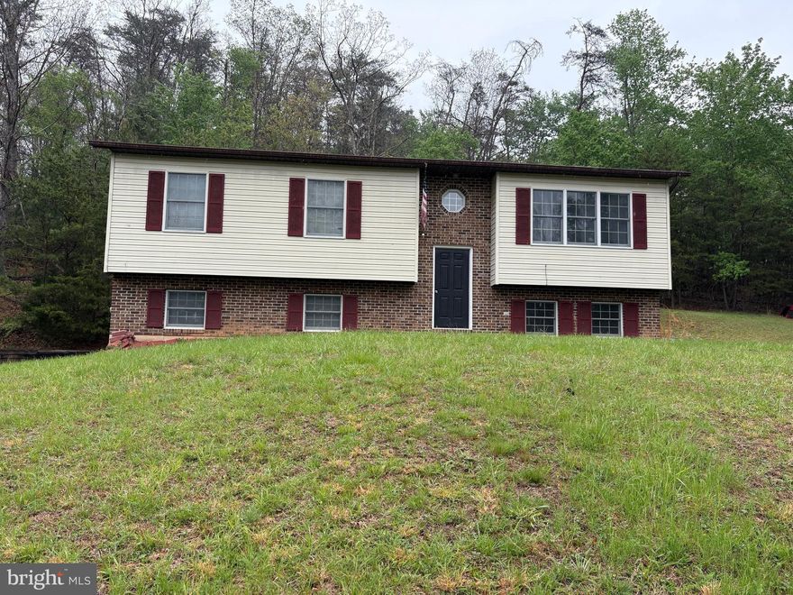 Split Level home on a private 9.44 acre lot!  This home is conveniently located near to Winchester VA but yet near Wardensville, WV and  many  WV scenic landmarks.  Three bedrooms and two full baths. The house is located on Lot 6 (4.66 ac) and the additional Lot 5 (4.8 ac lot) make a beautiful site for relaxing and entertaining. Call to schedule an appointment!