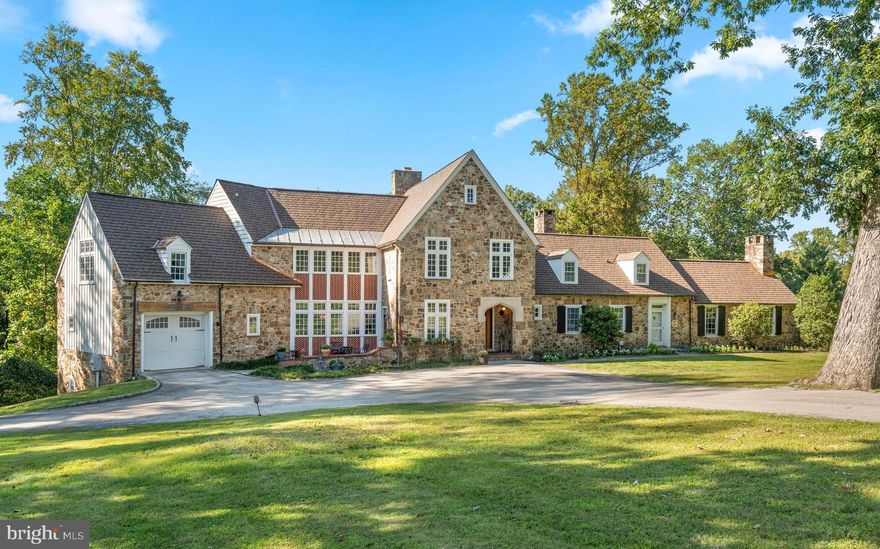 Welcome to 659 Andover Road, a truly exceptional property. This handsome stone manor home immediately captivates with its breathtaking curb appeal and is nestled on 3.15 acres in the premier estate section of Newtown Square. Here you are just steps from Aronimink Golf Club & Episcopal Academy, and 5 minutes to downtown Wayne & the Newtown Town Center. This expansive Archer & Buchanan designed home boasts 6 Bedrooms, 4 Full, 3 Half Baths, and 6,350 sq. ft. above grade and 9,975 sq.ft. total including the finished lower level. 
As you approach the majestic front door, take note of the NEW CertainTeeds’s Grand Manor architectural shingle roof with copper flashing that was just installed this summer! Step into the elegant family room which serves as the heart of the home with timeless coffered ceilings and floor to ceiling French doors that flank the show- stopping fireplace. This room flows effortlessly into a spacious kitchen which has been tastefully updated in 2025 with quartz counter tops & backsplash, lighting fixtures, high-end appliances, and freshly painted custom cabinetry. French doors in the kitchen lead to a massive deck, built in 2020, which offers a covered outdoor space complete with a gas fireplace and an inground pool, creating an ideal setting for outdoor entertaining. Through another set of French doors is the expansive yet intimate dining room.  Continuing through the home, the gorgeous hardwood floors lead to a light-filled office as well as a home library with custom-built cabinetry, both spaces provide the perfect tranquil setting for privacy & focus. An additional front door entrance allows for separate access for professional use if so desired and is adjacent to the office & library as well as the back staircase. Completing the first floor is the star of the home; an extensive vaulted-ceiling pub/game room, offering versatile space that oozes with character and charm.  
The main staircase ascends to the spectacular primary bedroom, which showcases a true sanctuary, boasting vaulted ceilings, a stunning array of windows, sitting area, two spacious outfitted walk-in closets and a luxurious en-suite bath with dual vanities, jetted tub, and an oversized walk-in shower. On the same level, there are four additional bedrooms and two bathrooms. The third floor offers a sixth bedroom with its own bathroom, providing a beautiful private suite perfect for visiting guests or an au-pair. The fully finished lower level of the home includes convenient access to the additional two rear garage bays, with back stairs leading directly into the mudroom. This walkout lower level features a large family room ideal for movies and games, a kitchenette, bonus room and a home gym. With neighboring properties selling up into the $3M+ price range, you don't want to miss this opportunity to call 659 Andover Road your home.