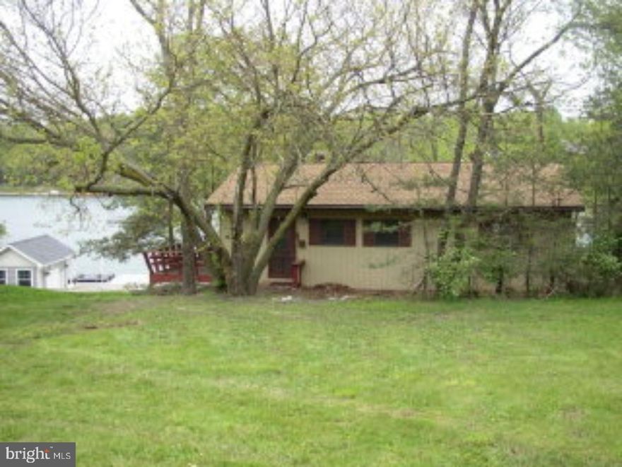 AFFORDABLE LAKEFRONT RANCH BUILT 65' FROM WATER FRONT WITH STONE BULKHEAD, 6 SETS OF SLIDING GLASS DOORS, GREAT GET-A-WAY OR ADD ON FOR YEAR ROUND LIVING, T 1-11 SIDING. Mailing Address Continued: AUBURN Color: TAN Amp: 200