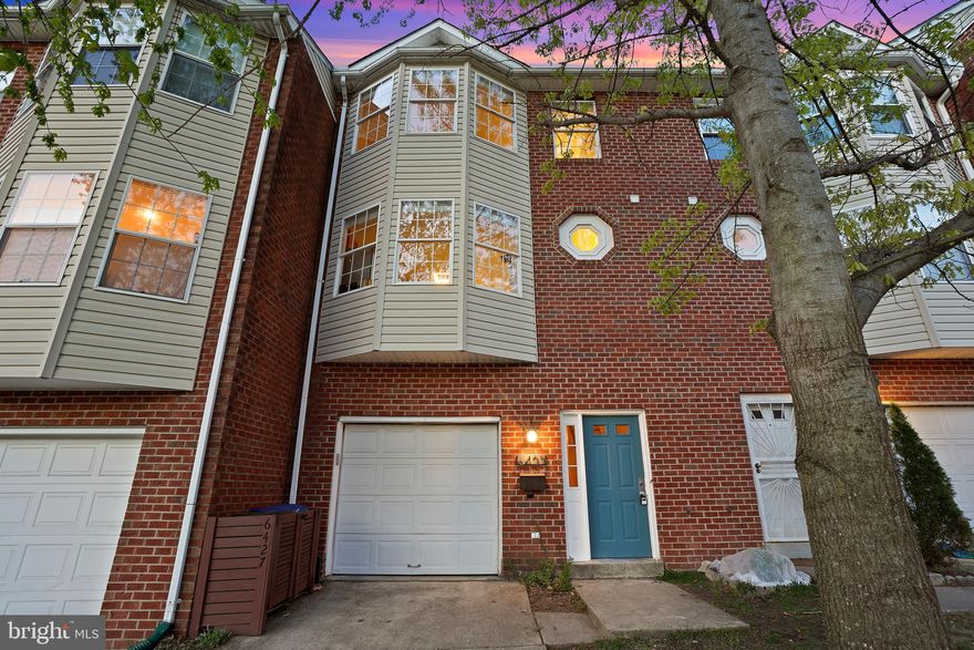 Welcome to this exceptional three-level rowhome in sought-after Takoma Park, offering a true 'forest in the city' experience! Overlooking the serene Sligo Mill Neighborhood Conservation Area, this stylish home, built in 1998, features three bedrooms, two full baths, and two powder rooms. Thoughtfully designed, it boasts open living spaces, a renovated kitchen and baths, inviting outdoor areas, and an attached garage—all with no HOA.

The entry level welcomes you with a foyer, a laundry closet, and a versatile fourth bedroom or office with an attached half bath. This level also provides direct access to the garage. Upstairs, the sunlit main floor offers an open-concept layout with a spacious living room flowing into the dining area and gourmet kitchen. Step onto the deck just off the living room to take in picturesque park views. Hardwood flooring and updated decorative lighting enhance the space. The large chef’s kitchen is beautifully appointed with stainless steel appliances, granite countertops, a five-burner gas range, a bay window, and a tile backsplash. A convenient powder room and pantry complete this level.

The upper floor features three bedrooms and two beautifully renovated full baths. The primary suite showcases wood flooring, ample closet space, and a charming bay window. Its en-suite bath has been tastefully updated with a floating double vanity and a glass barn door.
Outdoor spaces are equally inviting, including a picturesque deck off the main living area—perfect for relaxing or entertaining—along with a backyard that offers additional space to enjoy the natural surroundings. The attached garage provides secure parking and extra storage.
Nestled within the townhomes of Orchard Avenue, this residence backs up to the tranquil 6.5-acre Sligo Mill Neighborhood Conservation Area, an undeveloped parkland managed by the City of Takoma Park. This peaceful retreat is home to a lush tree canopy, Takoma Branch Creek, and local wildlife, including deer, rabbits, and birds. Nearby, Sligo Mill Overlook Neighborhood Park features a playground and a community garden maintained by the Maryland-National Capital Park and Planning Commission (M-NCPPC).
Enjoy easy access to downtown DC via North Capitol Street (just a 20-minute drive), Metro, or bus. A community garden and playground are just half a block away, and numerous walking trails weave through the neighborhood, fostering a deep connection to nature. Experience the best of Takoma Park—a vibrant, tight-knit community with convenient access to shopping, dining, entertainment, and the Takoma Metro Station, just about a mile away.