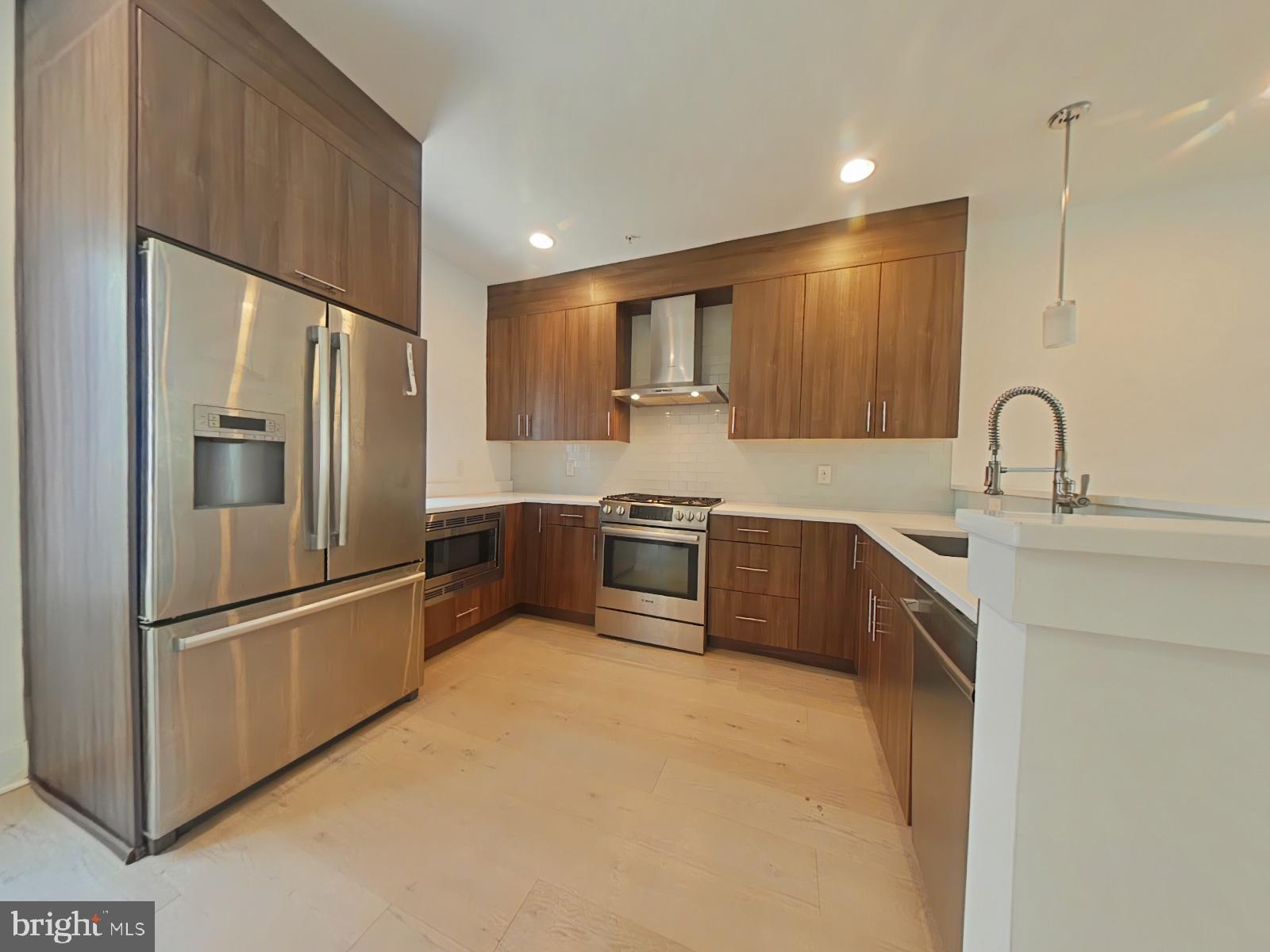 Introducing the pinnacle of luxury townhome living in the heart of Northern Liberties!
This beautifully designed home features 3 bedrooms, 3 full bathrooms, and an attached one-car garage, all set in one of Philadelphia’s most desirable neighborhoods. From the moment you step inside, you’re welcomed by a bright and open-concept layout that’s ideal for both entertaining, everyday relaxation, and a real place you can call home. The second floor offers a sun-filled living room, dining space, and a chef-inspired kitchen that’s sure to impress.
The kitchen stands out with its sleek stainless steel appliances — including a refrigerator, dishwasher, gas oven/range, and built-in range hood — all accented by dark maple European-style cabinetry and luxurious natural quartz countertops. This space perfectly combines modern elegance with practicality.
Upstairs, you’ll find three spacious bedrooms, a spa-like full bathroom, and a high-efficiency washer and dryer, offering total convenience. The primary bedroom spans approximately 500 square feet and exudes sophistication, featuring a huge walk-in closet and a stunning en-suite bath. Highlights include a double quartz vanity, frameless glass shower, upscale Grohe fixtures, and a distinctive riverstone-tiled floor — all designed to bring a spa experience to your everyday life.
At the top of the home, enjoy your private rooftop deck with sweeping views of the Philadelphia skyline — the perfect spot to relax or entertain under the stars.
A 13-month HWA home warranty is included with an acceptable offer and must be noted in the Agreement of Sale.
Set in the lively Northern Liberties neighborhood, you’re just steps away from an array of shops, restaurants, and nightlife that make this area so desirable.
With a Walk Score of 87, you'll be able to run most errands on foot. The Transit Score of 78 means you’ll have easy access to public transportation, and a Bike Score of 83 highlights strong biking infrastructure — great for commuting or leisurely rides. Local favorites like Jerry’s Bar, Germantown Garden, and The 700 Club are just minutes away, as are essentials like Penn Herb Co. Families will appreciate nearby schools such as General Philip Kearny School and Benjamin Franklin High School.
Outdoor lovers will enjoy close proximity to Liberty Lands Park, Tiptop Playground, and the Edgar Allan Poe National Historic Site, all perfect for fresh air, fun, and Philly’s rich history.
This is your chance to own a true gem in Northern Liberties — schedule your showing today!
