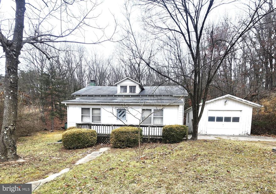 Step back in time with this practical and affordable 1.5 story single-family home in rural Augusta, WV. Featuring 3 bedrooms and 1 bath, the home offers a  spacious living room with hardwood flooring, and a large kitchen.  The dining  area and a cozy family room bookcase the the kitchen making it perfect space for family gatherings.  Situated on a 0.75-acre unrestricted parcel, the property includes a single-car detached garage and an additional outbuilding for extra storage or hobbies or a few free-range chickens! This home is a great opportunity for those looking for a project, offering the chance to restore and modernize a functional 1940’s home with character and antiquity. Conveniently located on Northwestern Pike, Augusta, WV, it’s just a short commute to Winchester, VA, making it a balanced blend of rural living with access to nearby services.  This property is sold strictly as-is. Don't miss the potential it holds!