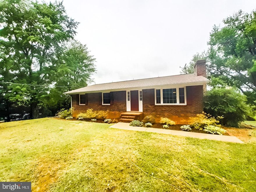 One level all brick home on a private 1 acre lot.  The main level has a large eat-in kitchen the opens to the living room with pellet stove, new LVP flooring in living room, fresh paint, 2 secondary bedrooms and hallway bath.  The primary bedroom with private full bath finish off this level.  The lower level has the laundry area, ample storage and  recreation room with wood burning fireplace.