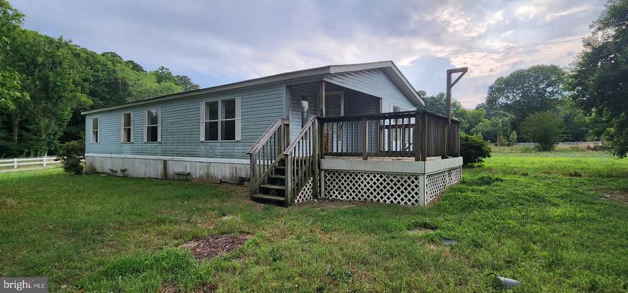 Mobile home located on level 1.52 acre lot.  A Mortgage Insurance claim is pending. As such, sale of the property is subject to the approval of the mortgage insurance carrier. If a buyer is found before their claim is settled, approval will be sought from the carrier. They will have the option to approve the sale and settle the claim or take title to the property. The Seller retains the right to terminate this listing or any agreement of sale executed if the mortgage insurance carrier exercises their option to take title to the property.