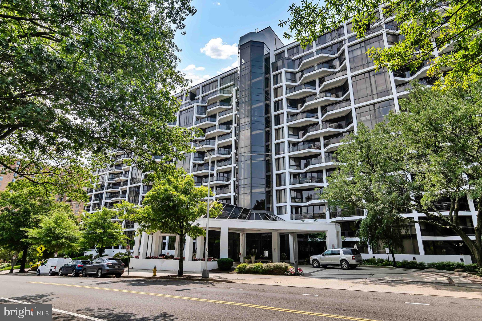 Live now at The Atrium, a rare and spacious 2-bedroom, 2-bathroom corner unit, offering over 1,400 square feet of beautifully updated living space. This bright and inviting home features sweeping views of Georgetown to the north and overlooks the swimming pool and city skyline to the west. Floor-to-ceiling windows and two private balconies fill the home with abundant natural light. The open layout is enhanced by upgraded wood flooring throughout and a fully remodeled kitchen featuring stainless steel appliances, sleek countertops, and crisp & modern white cabinetry. The home includes generous closet space and a dedicated laundry room with in-unit washer and dryer for added convenience. Heating and cooling are never an issue with an HVAC system that’s less than two years old. Two assigned parking spaces and a private storage bin are included in the sale. This home has it all! Condo fees cover internet, cable TV, and water. Enjoy exceptional amenities including a swimming pool, tennis court, fitness center, and 24-hour front desk. Ideally located within walking distance to Georgetown, the Rosslyn Metro, grocery stores, restaurants, bars, and more. Schedule your private tour today!