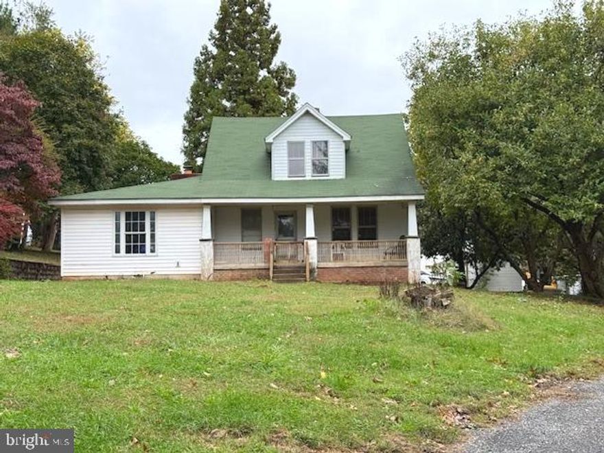 Two separately deeded properties (2.55 ac w/house and 5.31 ac with pond) make up the 7.86 acres. Enjoy your own private oasis as you sit on the front porch or back deck taking in the views of your own redwood tree, magnolia(s), and black walnut(s). Meander over to your own private pond to enjoy a picnic or meditate in the serenity of the views. With an eat-in kitchen, full bath, washer/dryer, and five other rooms on the main level, with three outside entrances, realize the potential to create your living space that is only limited by your imagination.  Cozy up by the brick, wood-burning fireplace with a beverage. The upper level has four bedrooms with the primary bedroom having direct access to the deck to enjoy your morning coffee or a relaxing evening. The basement level is drywalled to create four separate rooms and includes an additional washer/dryer -  walk up stairs with bilco doors provide an exit to side yard. Outside find the a large shed and oversized detached two car garage boasting two 12' wide doors for easy access. Verizon for internet and tv.  Showing appointments require 24 hour notice. NO DRIVE-BYS - HOUSE IS NOT VISIBLE FROM THE ROAD - PLEASE DO NOT ENTER THE DRIVEWAY WITHOUT A CONFIRMED APPOINTMENT. This property is being sold as-is to settle an estate. Inspections are for informational purposes only.