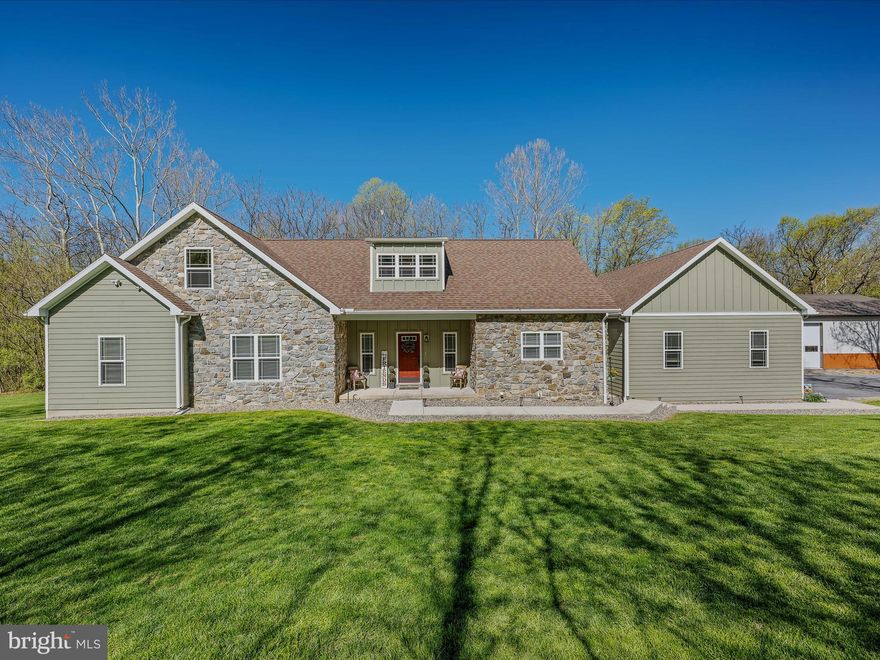 Unique opportunity to own a remarkable bonus ranch home in a great community that is easy to travel to, the Crossings on the Potomac.  Well taken care of home, with lots of natural light. Large kitchen with island and plenty of space.  Great sized rooms with plenty of closet space.  Full basement with a vault and roughed in plumbing for a bath and a bar.  Custom tile works throughout the home.  Attic space that can easily be finished for more living space, including roughed in for bathroom.  Enjoy the gas fireplace and central heat and air with 4 possible zones.  Community features a marina with Potomac River access.  Enjoy time out on the large rear deck facing the backyard.  Attached Garage  is 26x36 with three bays, radiant floor heat, and a 2 post lift with 10,000 lbs capacity.  Detached garage is newly constructed and plenty of space for a workshop and vehicles and is 40x80.  The land continues in the back with plenty of woods with water view at the bottom.  Great internet service that can convey.  Come see this beautiful home!